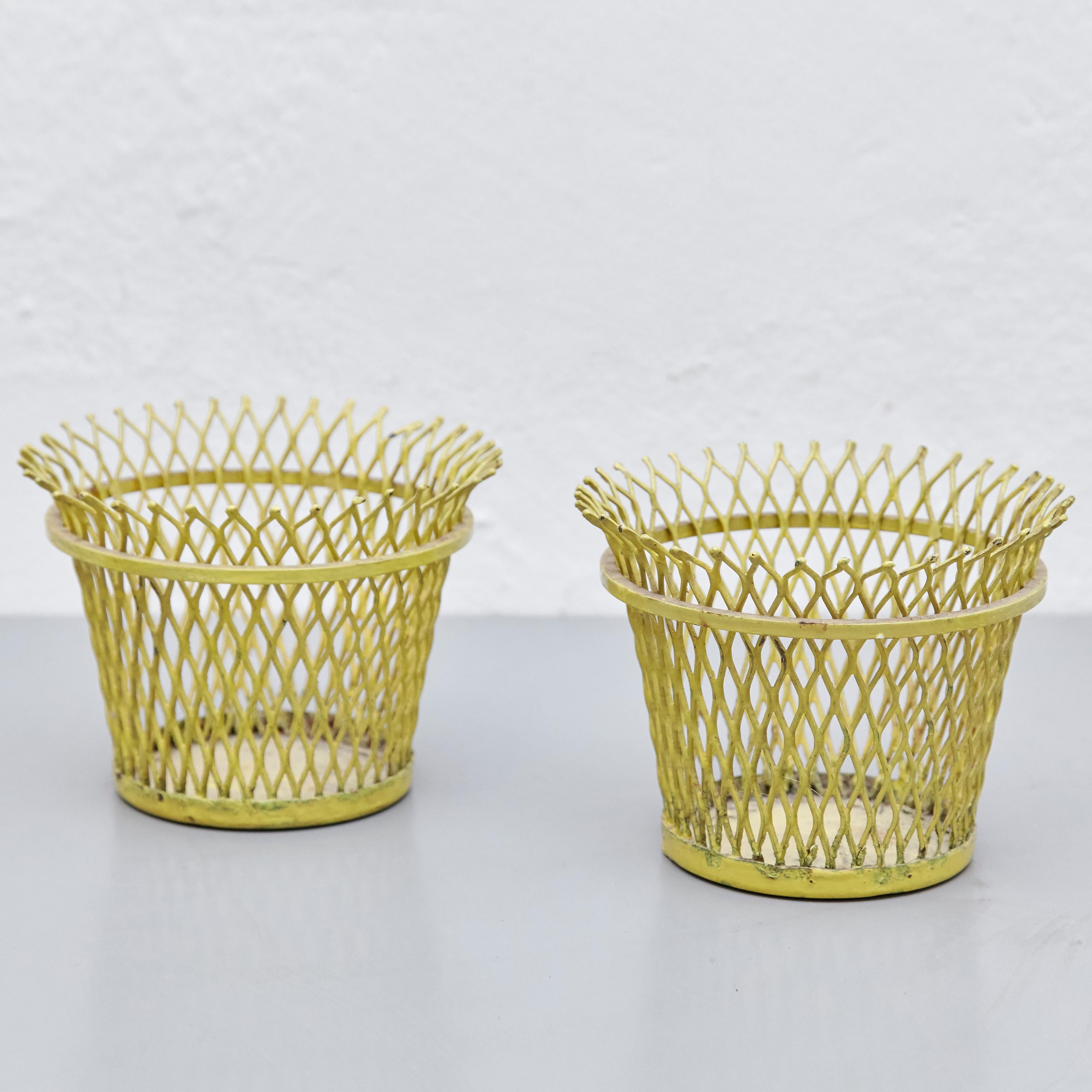 Enameled metal baskets designed by Mathieu Matégot.
Manufactured by Ateliers Matégot (France,) circa 1950.
Lacquered perforated metal, it has some traces of rust.

In original condition, with wear consistent with age and use, preserving a