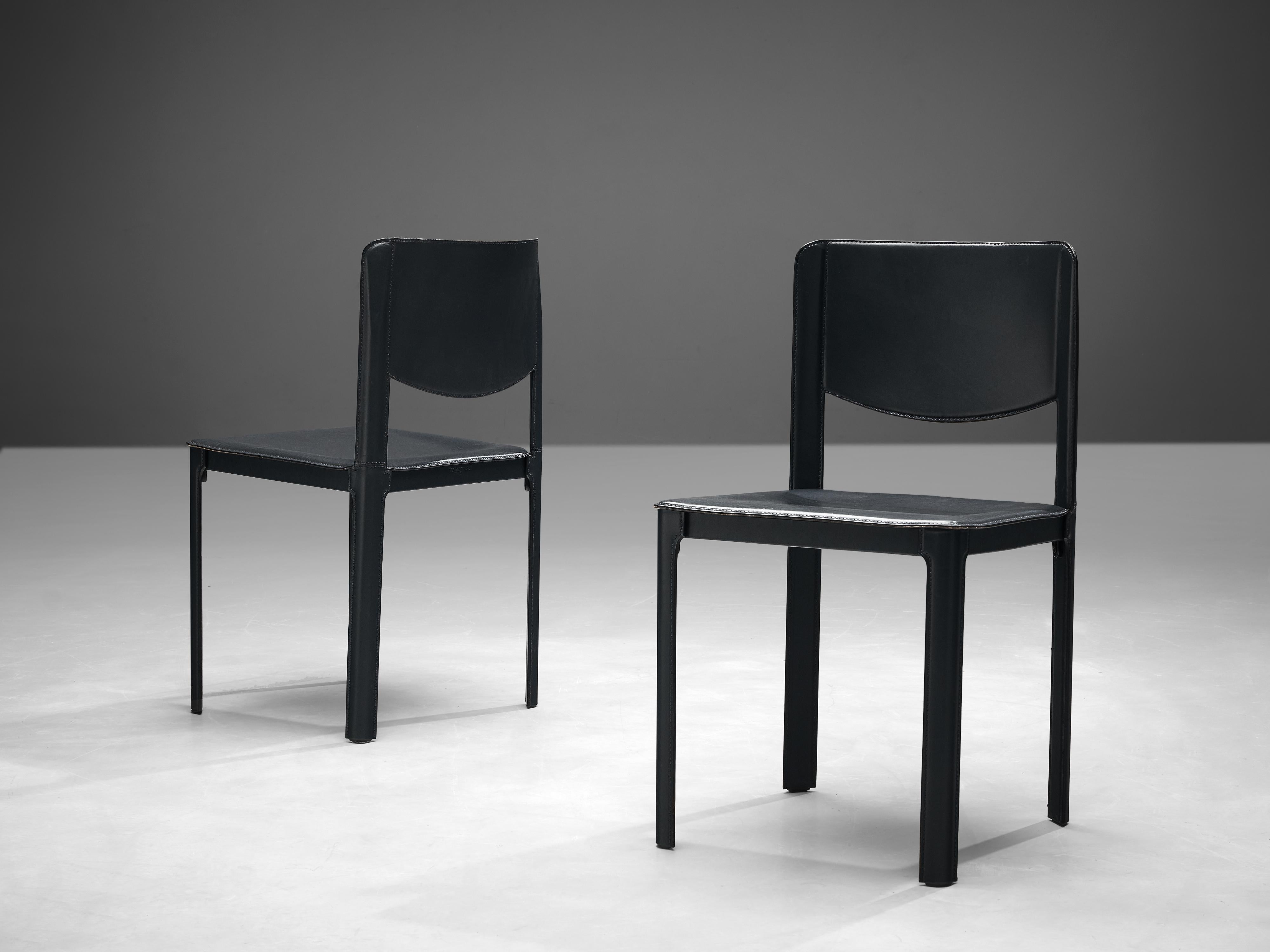 Matteo Grassi, pair of dining chairs, leather and steel, Italy, 1980s.

These sophisticated dark blue leather chairs with an angular design are designed for Italian manufacturer Matteo Grassi. The seat and base are upholstered in leather, covering