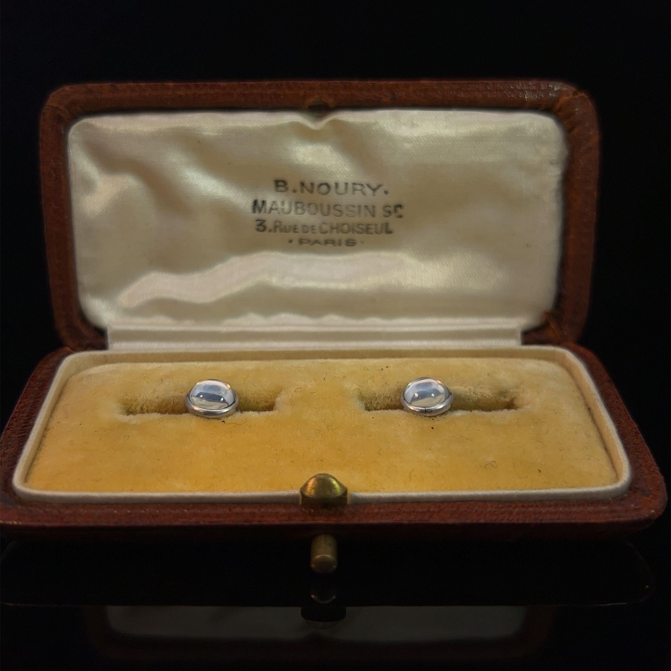 One pair of shirt studs each set with a moonstone and with a yellow gold sprung fitting. Housed in original Mauboussin case.

Mauboussin is a renowned French jewellery and luxury goods company with a rich history dating back to 1827. While