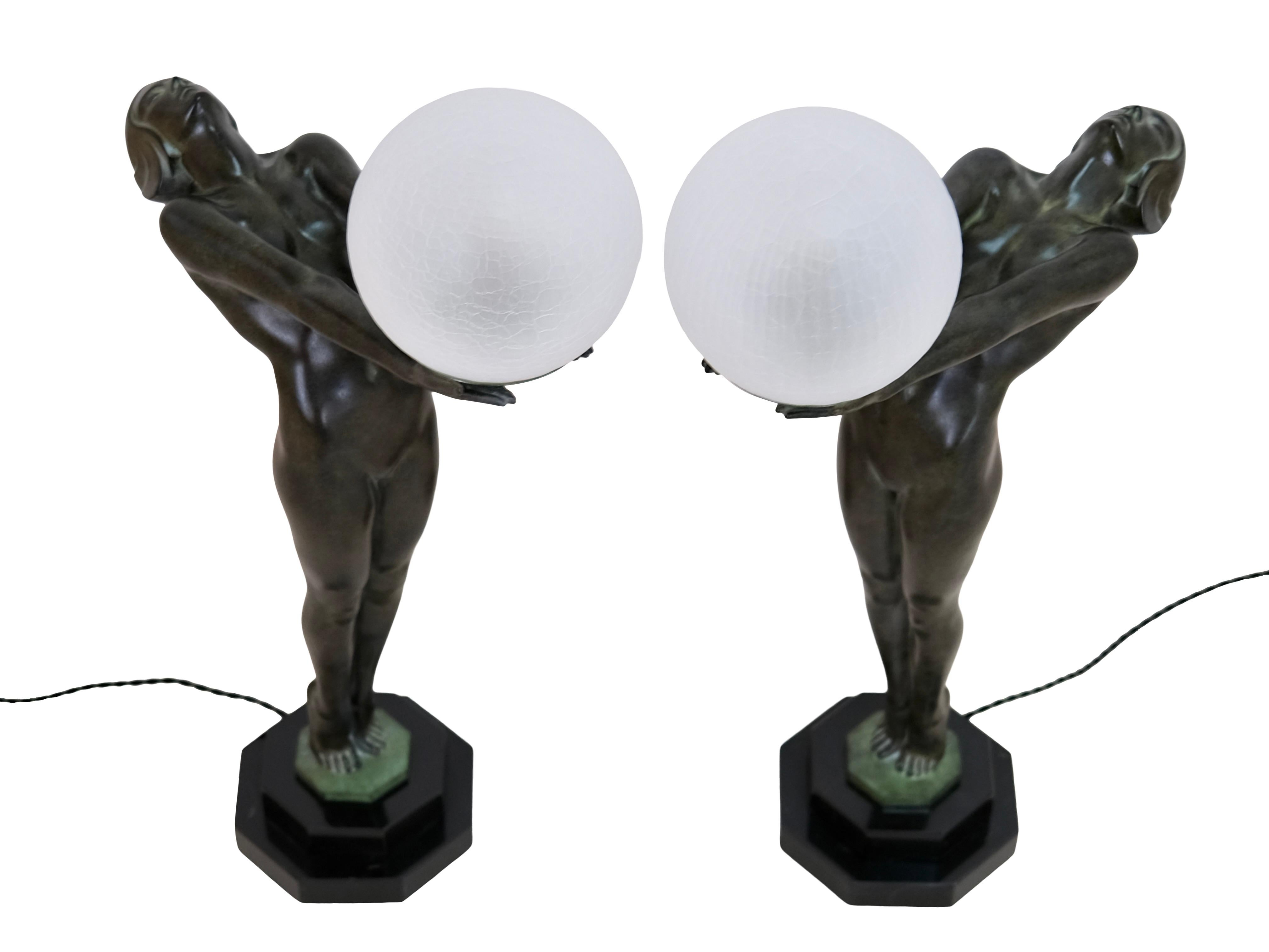 Patinated Pair of Max Le Verrier Clarte Art Deco Sculpture Lamps Nude with a Glass Ball