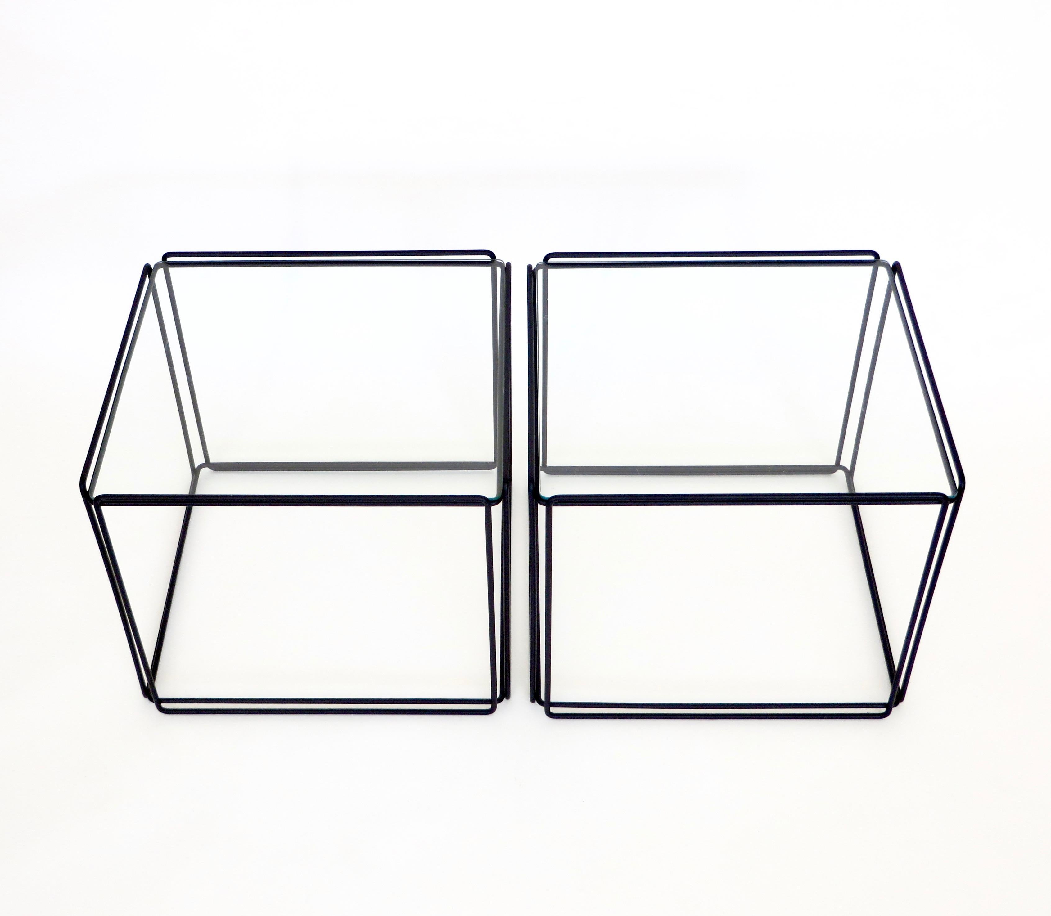 Pair of Isocele side or coffee tables by artist Max Sauze, circa 1970s, France.
Constructed of black enameled steel and glass.
There are two pair available, they can be used as side tables or put together as one large coffee table.
Each pair sold