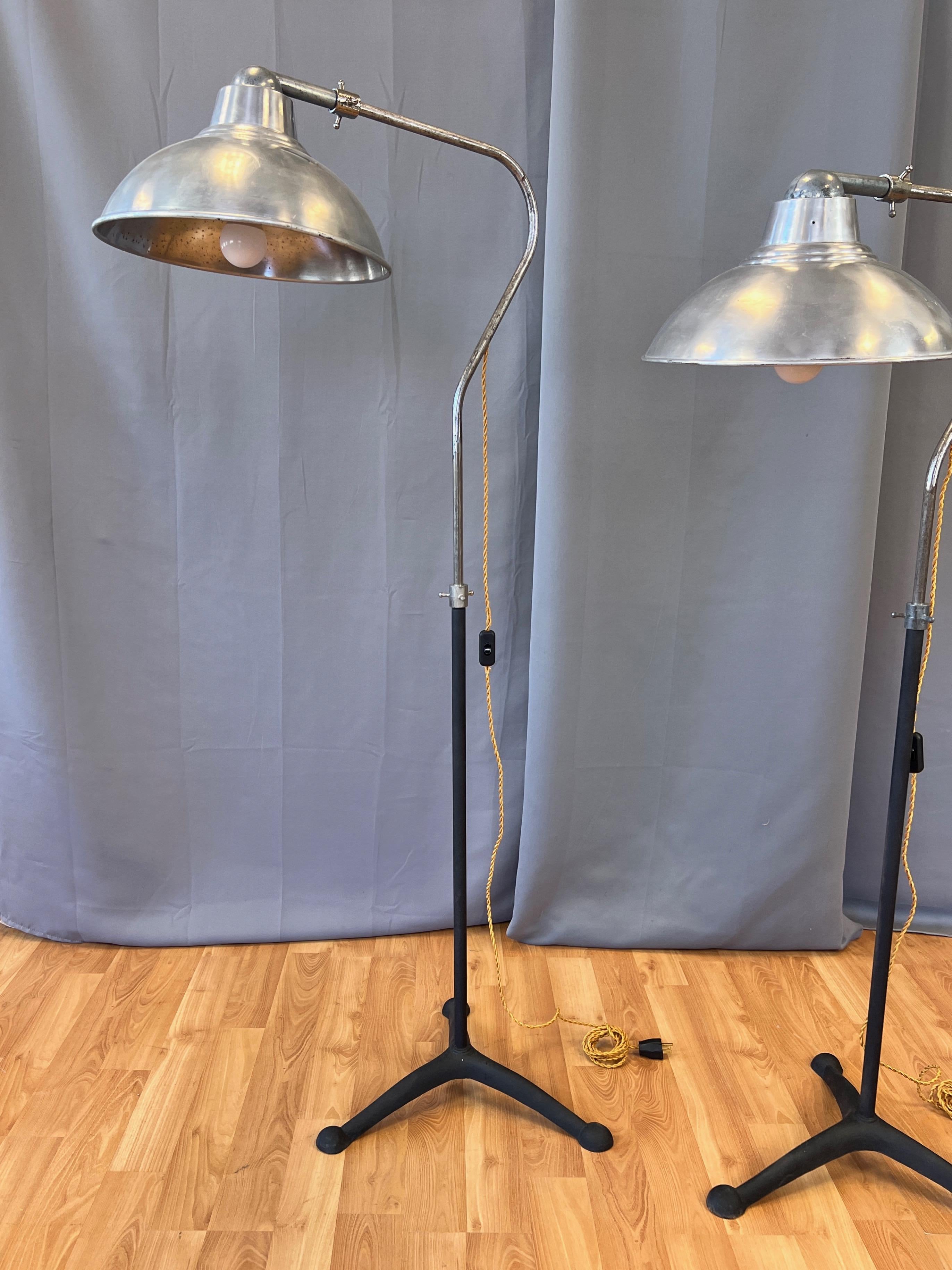 Metal Pair of McCall’s Desert-Air Industrial Adjustable Aluminum Floor Lamps, 1930s