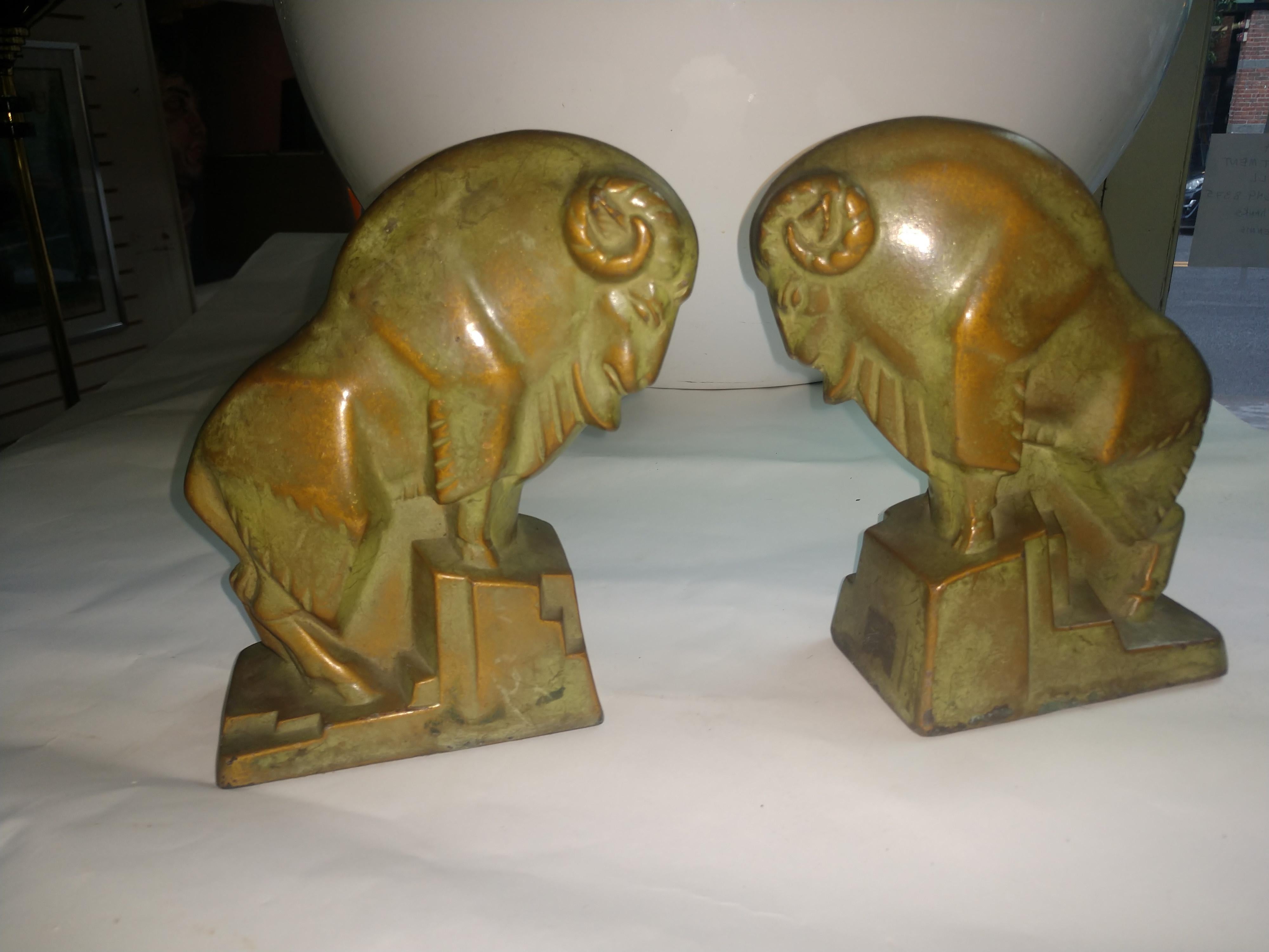 Fabulous bronzed with green patina Art Deco cubist style bookends. Signed McClelland & Barclays on back bottom edge. In excellent vintage condition with minimal wear.