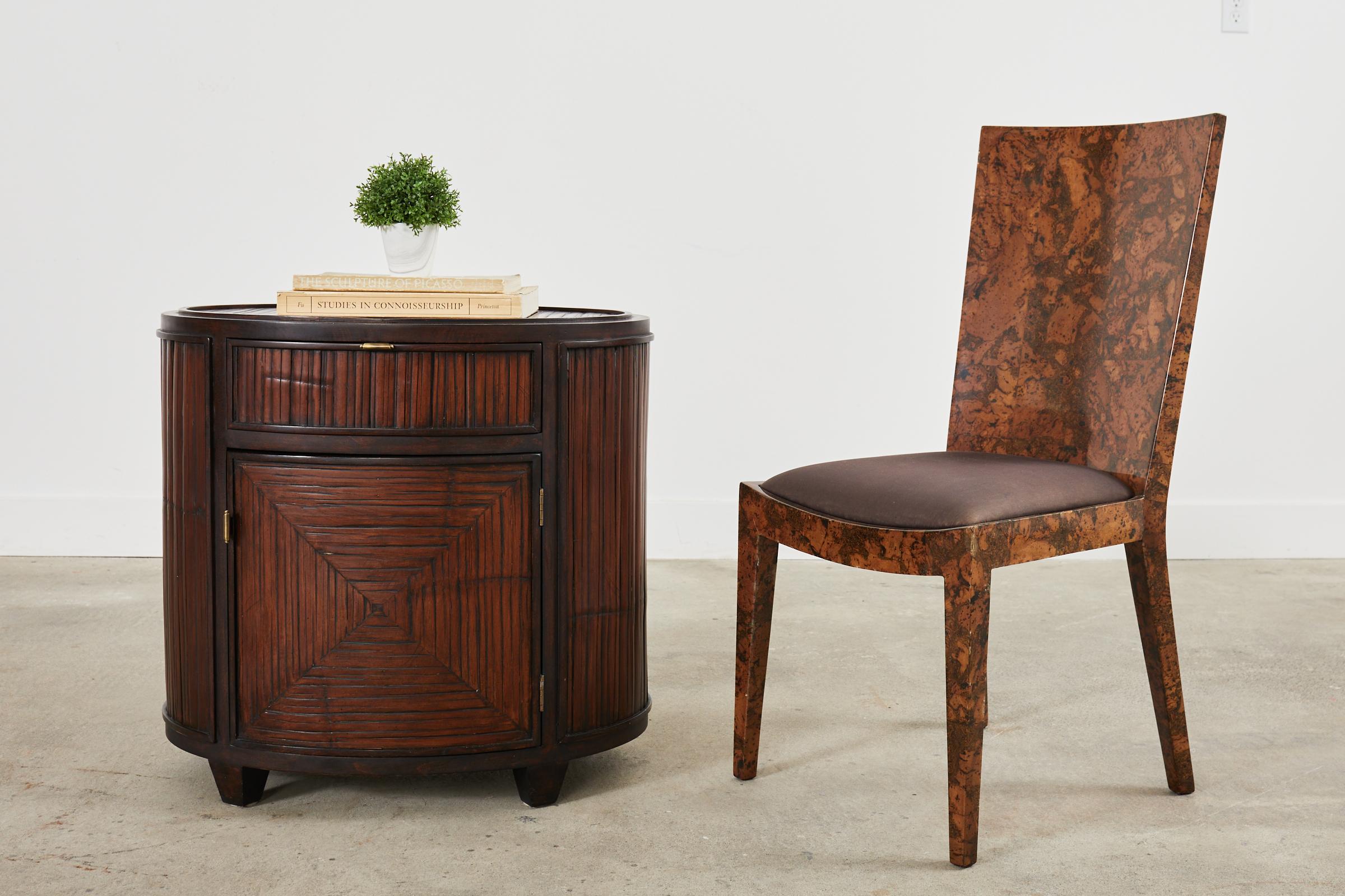 Stunning pair of McGuire oval drum form nightstands or bedside tables that could also serve as end tables, side tables, or lamp tables. Made in the California organic modern style from oak frames embellished with split bamboo veneers in interesting