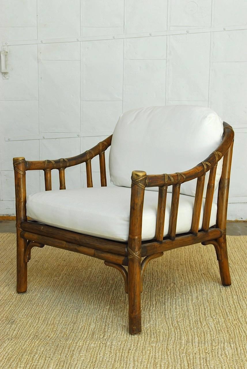 American Pair of McGuire Bamboo Rattan Lounge Chairs with Ottomans