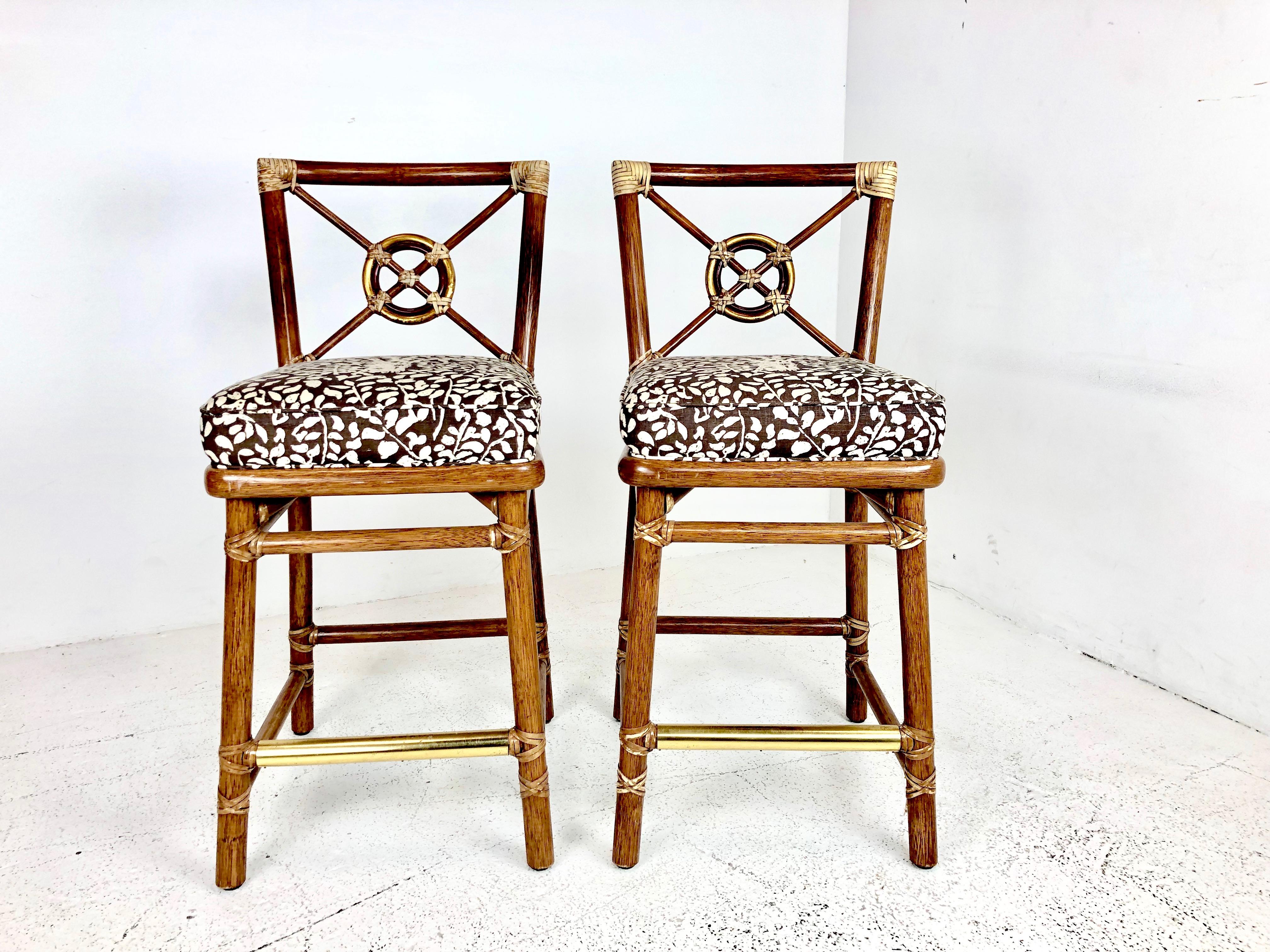 Pair of McGuire bar stools. Stools are in good vintage condition with signs of wear from use and age.

Dimensions:
18 W x 23.5 D x 38.5 T
Seat height 27
Seat width 16.