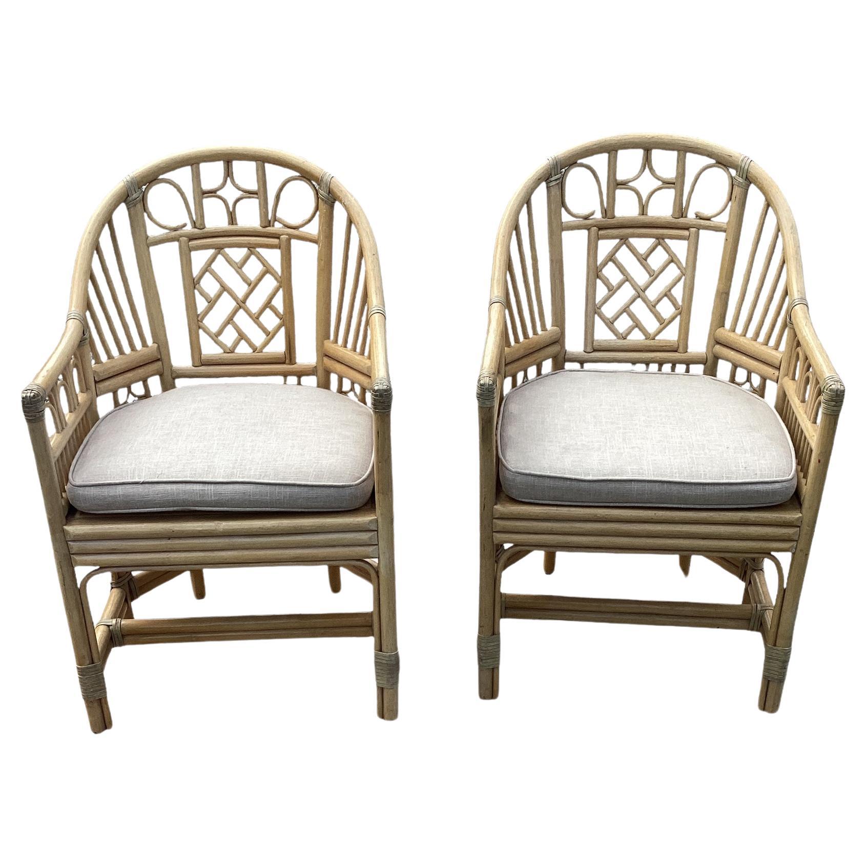 Pair of Vintage Brighton Pavilion Style Chinese Chippendale Rattan and Split Reed Chairs with Caned Seats attributed to McGuire. Brighton Pavilion refers to the Royal Pavilion in Brighton, England. It is a famous and distinctive building with
