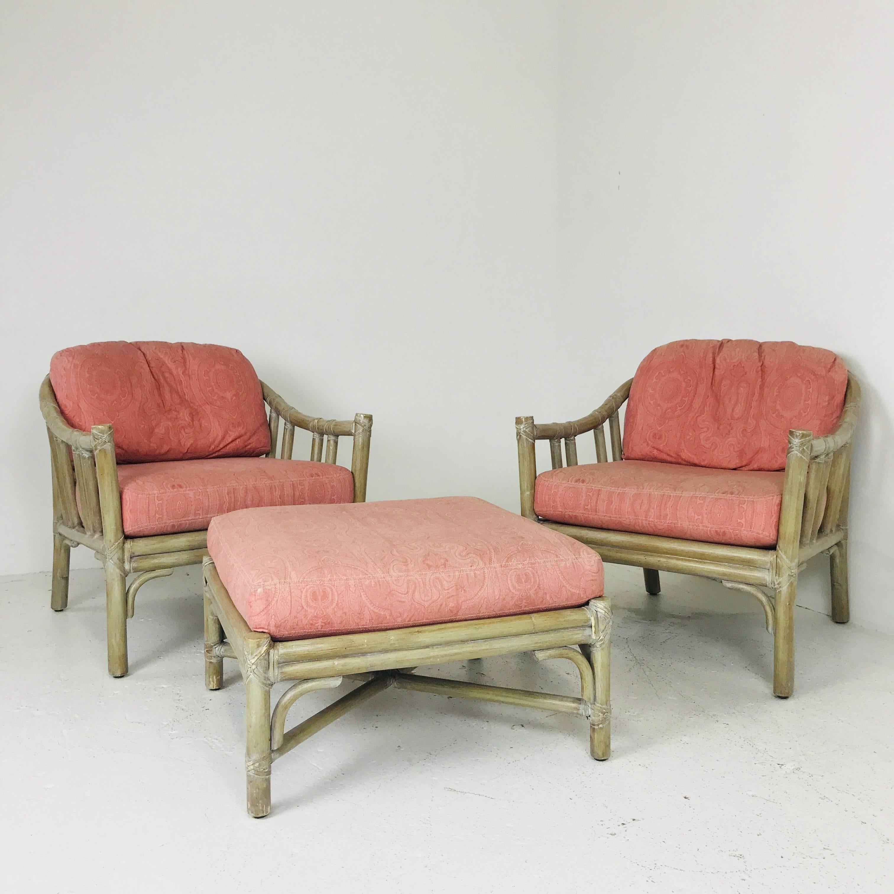 Pair of McGuire lounge chairs with ottoman. Chairs and ottoman are in good vintage condition with wear due to age and use. New upholstery and finish is recommend but can be used as is.

Dimensions: 27.5