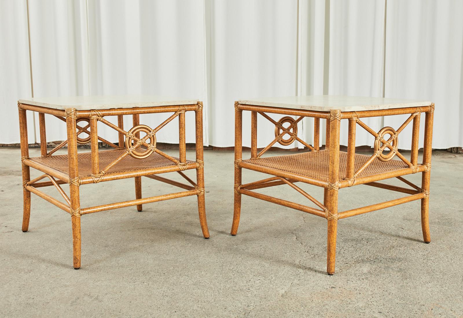 Stylish pair of lacquered rattan two-tier target design end tables or side tables by McGuire. These rare tables were designed by Elinor McGuire featuring their iconic target motif design with an optional gilt outer ring. The tables are topped with a