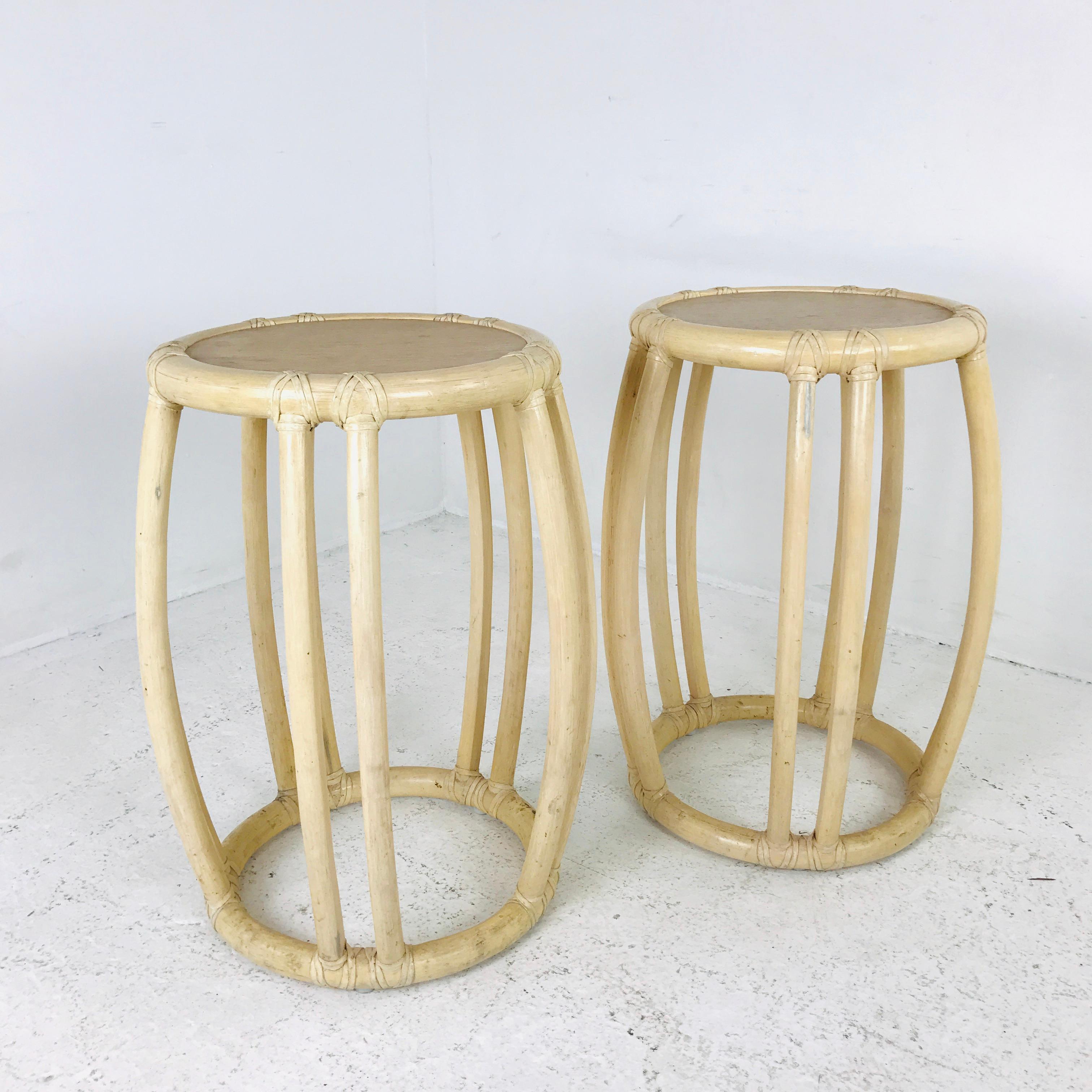 A pair of beautiful bamboo and rattan trimmed drum side tables/stools. Diameter of top measures 15