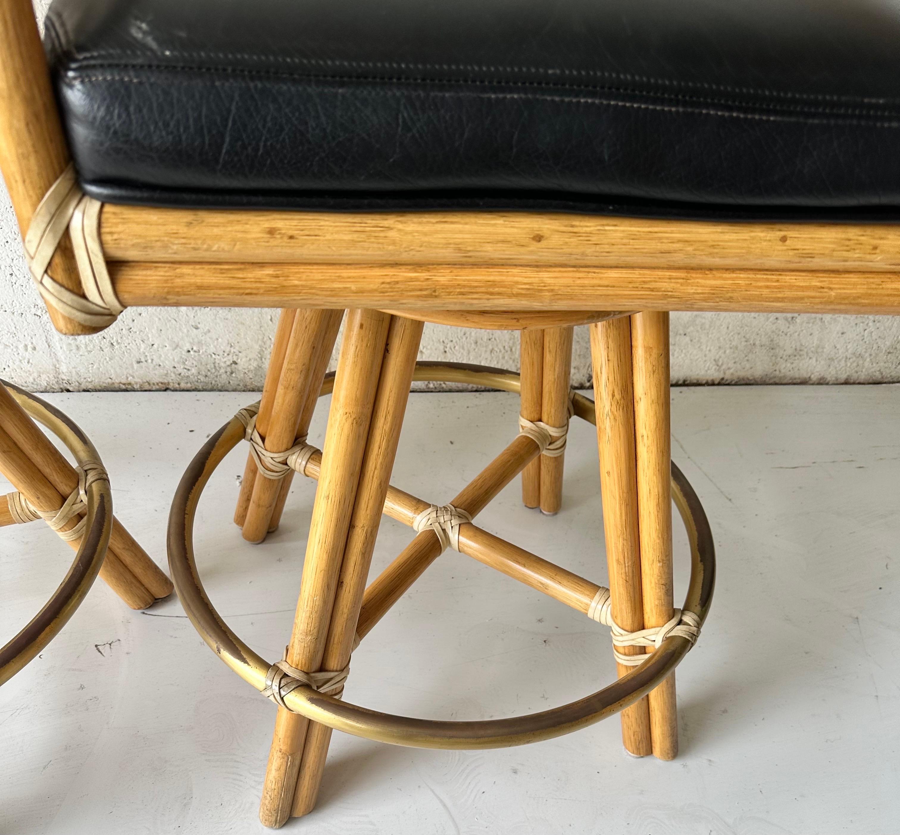 Pair of McGuire Rattan swiveling Bar stools In Good Condition For Sale In Miami, FL