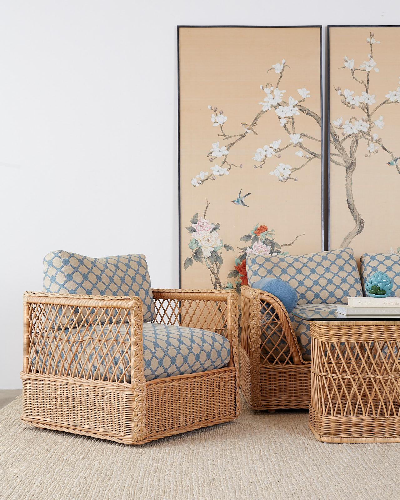 Rare pair of California organic modern style rattan wicker cube lounge chairs or club chairs made by McGuire. Features a cube style rattan and wood frame covered with woven wicker. The bottoms have a tight weave pattern while the tops of the side