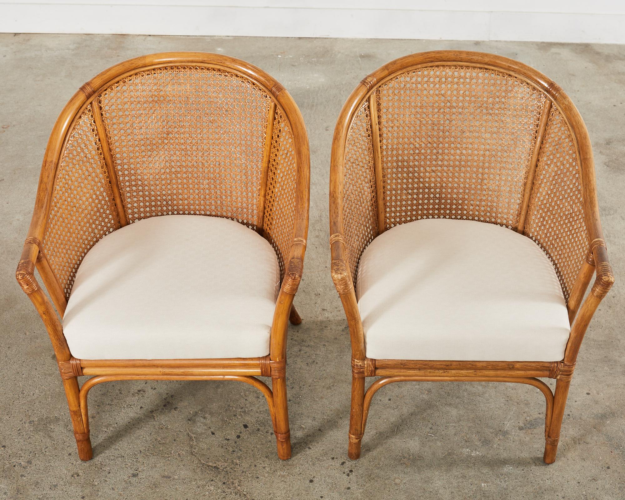 Hand-Crafted Pair of McGuire Style Rattan Cane Barrel Back Armchairs For Sale