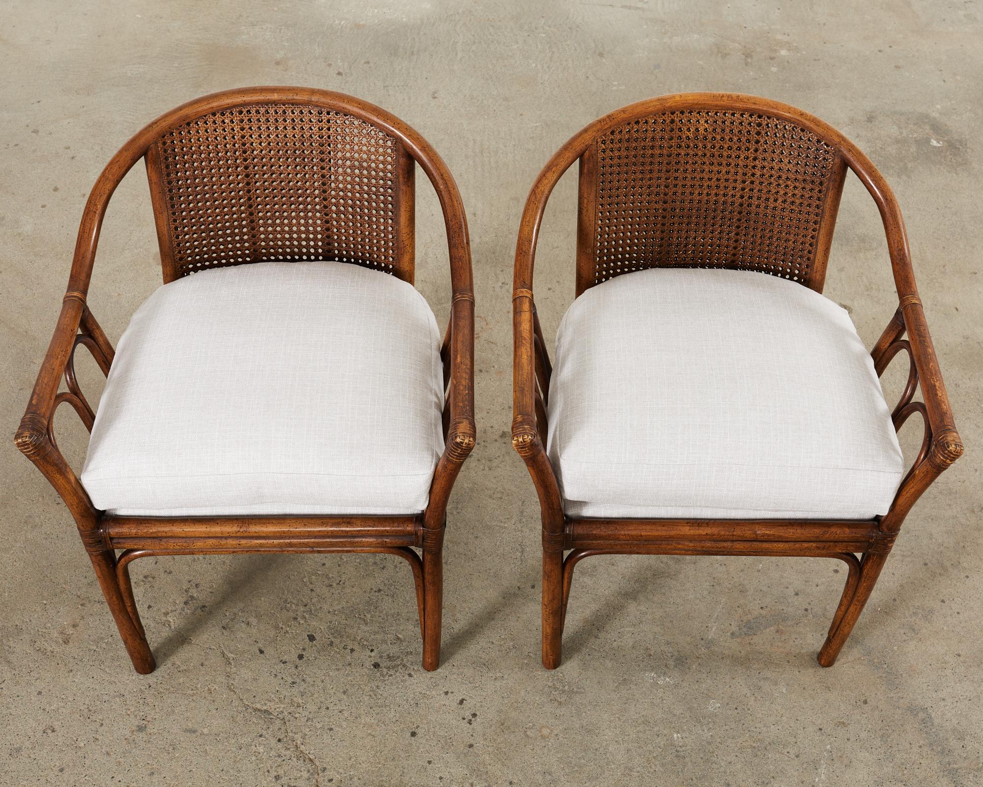 Hand-Crafted Pair of McGuire Style Rattan Cane Barrel Back Armchairs For Sale
