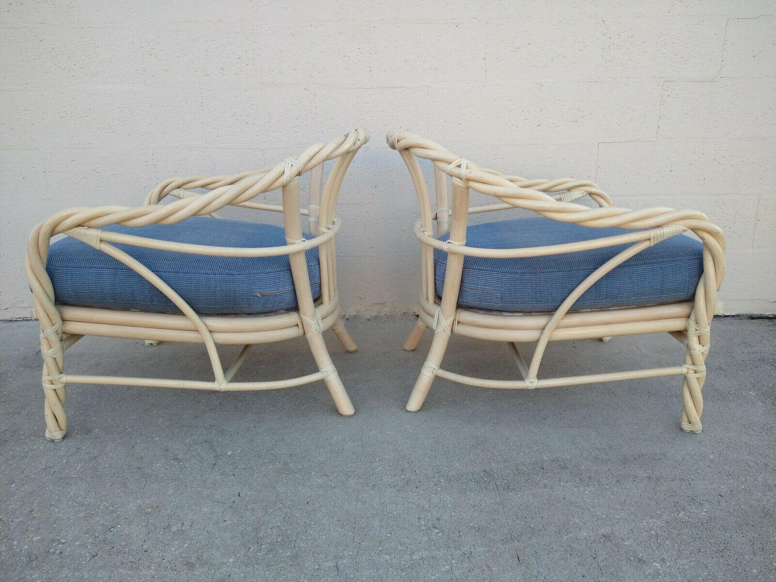 A pair of twisted rattan lounge chairs in original finish by McGuire of San Francisco will bring good vibes anywhere you place them in your home. Stunning and sturdy, the chairs are expertly constructed of rattan with leather binding accents.