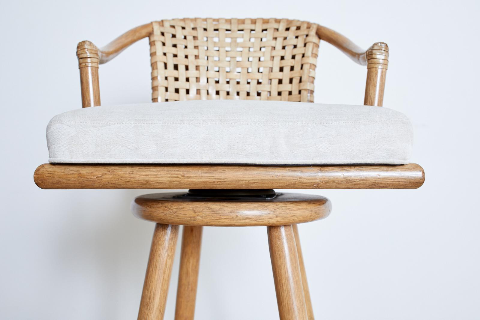 20th Century Pair of McGuire Woven Leather Rattan Swivel Barstools