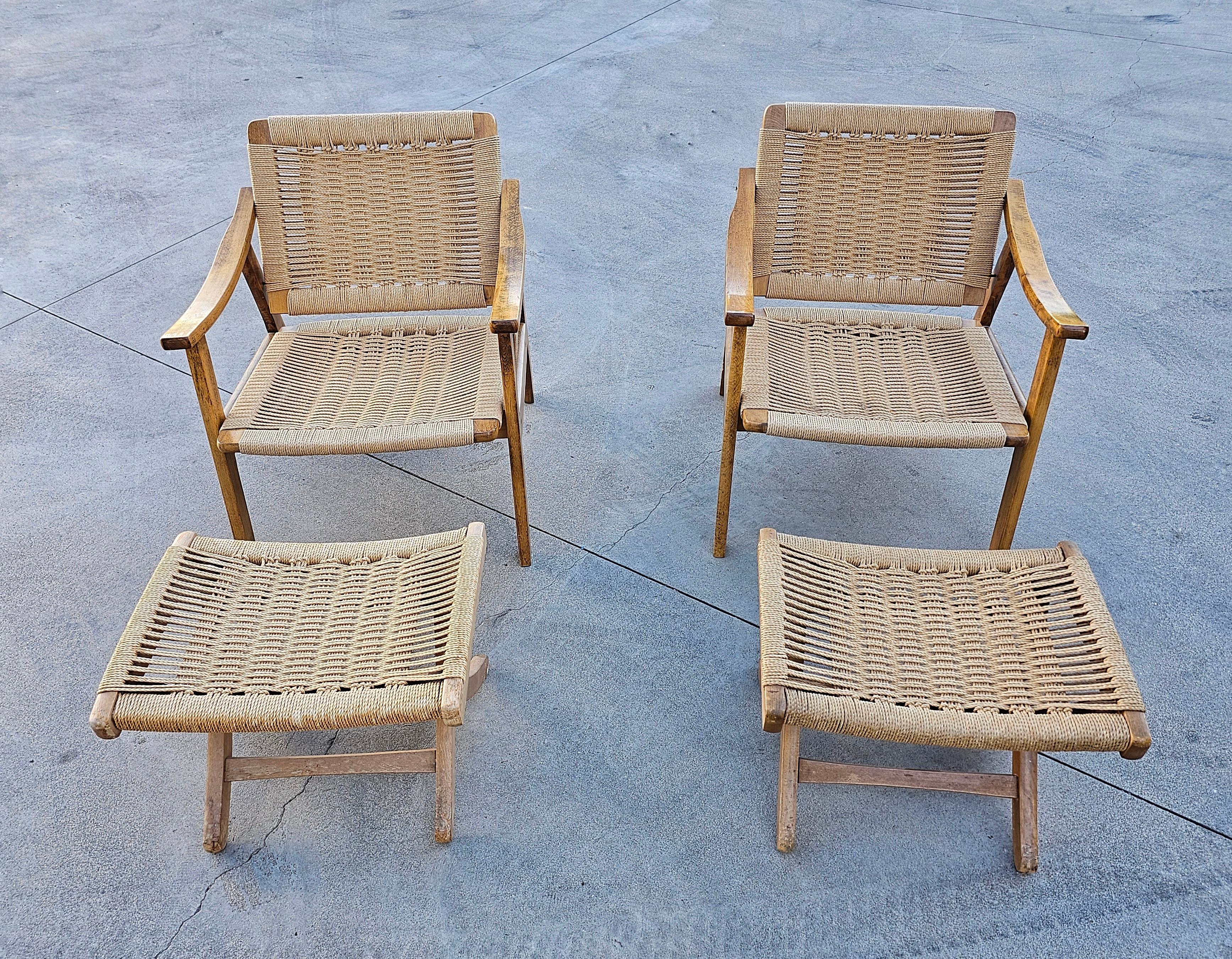In this listing you will find two gorgeous, rare armchairs with ottomans done in oak with Danish paper cord hand-woven seats and backrests. They are designed in style of Hans J. Wegner and manufactured in Yugoslavia in 1960s.

This set consists of 4