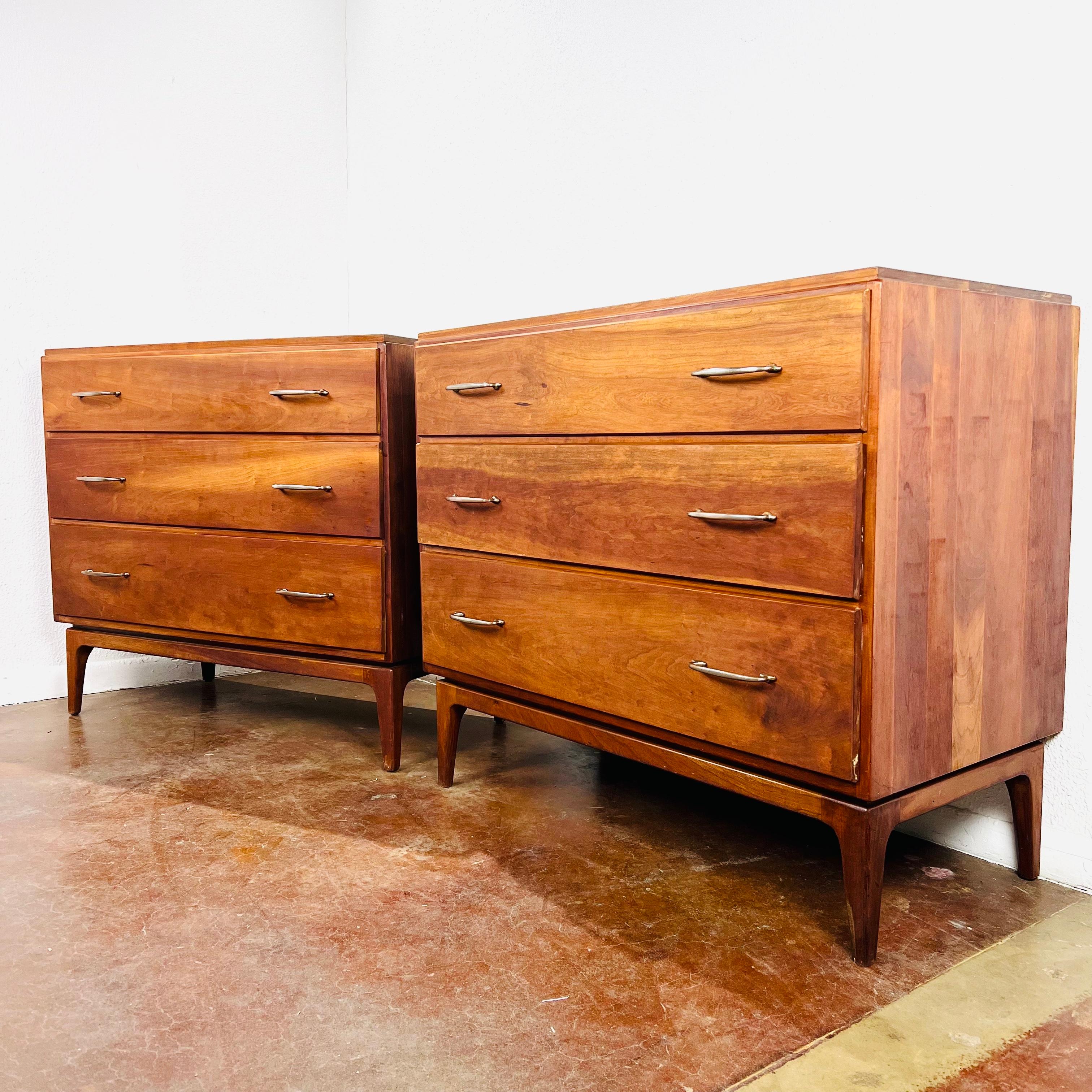 Clean lined mid century cherry chests by Statton, circa 1960s. They offer a generous amount of storage with three deep drawers in each chest. Good structural condition with some surface wear / scratches / dings; refinishing is recommended.