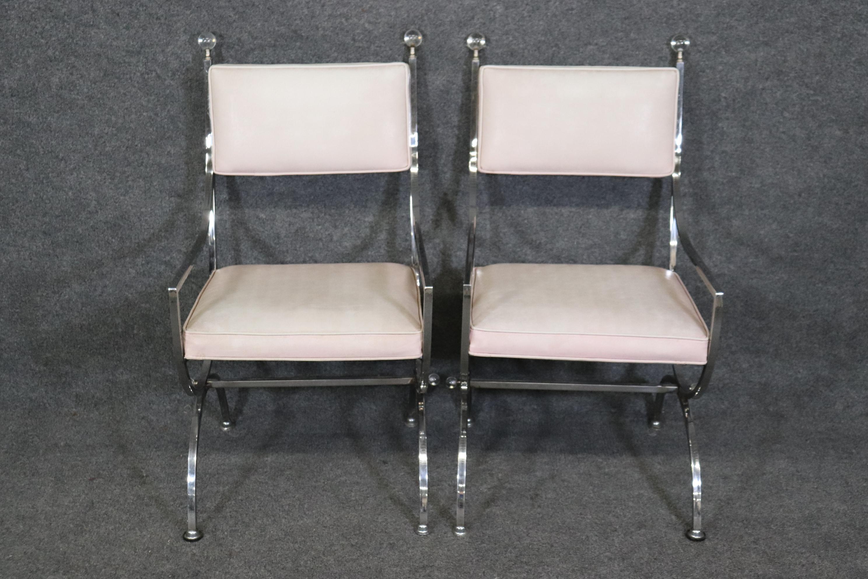 Dimensions- H: 35 3/4in W: 21 1/2in D: 23 3/4in SH: 17 3/4in 
This Pair of Jacques Adnet Style Chrome and Lucite Armchairs in the Hollywood Regency style are truly magnificent if you take a look at the photos provided you will see the lovely lucite