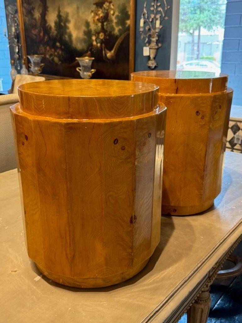 This product is a pair of MCM  style Italian Burlwood Drum Tables. These sleek and elegant tables are made of high-quality burlwood, adding a touch of luxury to any living space. With a unique and timeless design, they are sure to be a focal point