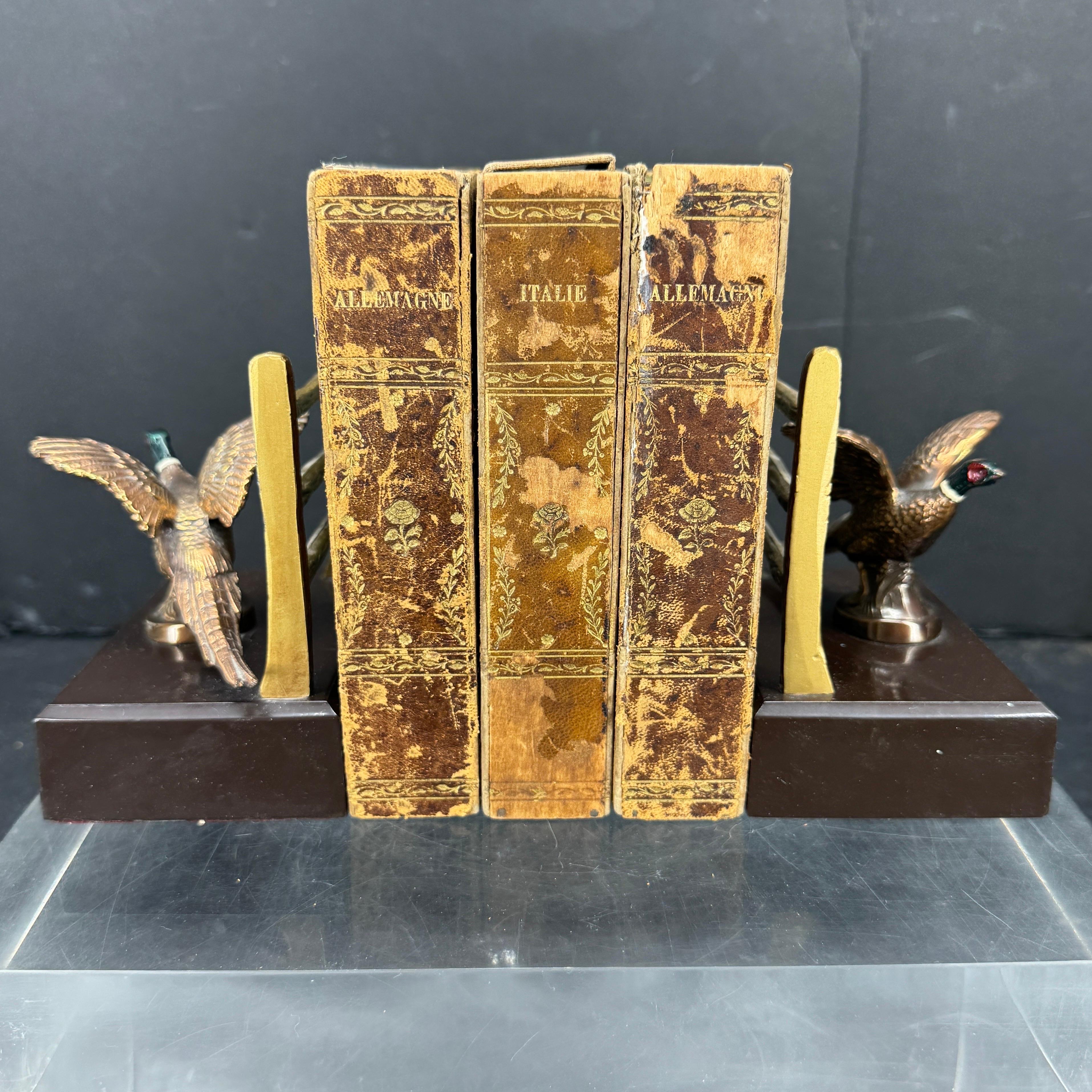 Impressive Pair of Mid-Century Modern Patinated Bronze Faux Bois Brass Bookends Featuring Geese. Absolutely spot on in terms of this MCM period, this pair will add to that vibe classic modern vibe displayed on a bookcase or desk. These classic