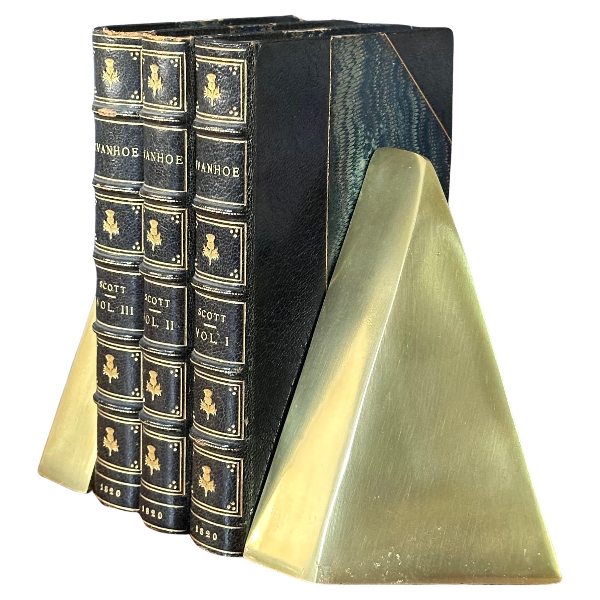 Pair of MCM sculptural brass bookends in the style of William Macowski, 1970s.  The pair are in very good vintage condition with a great patina and measure 7.5