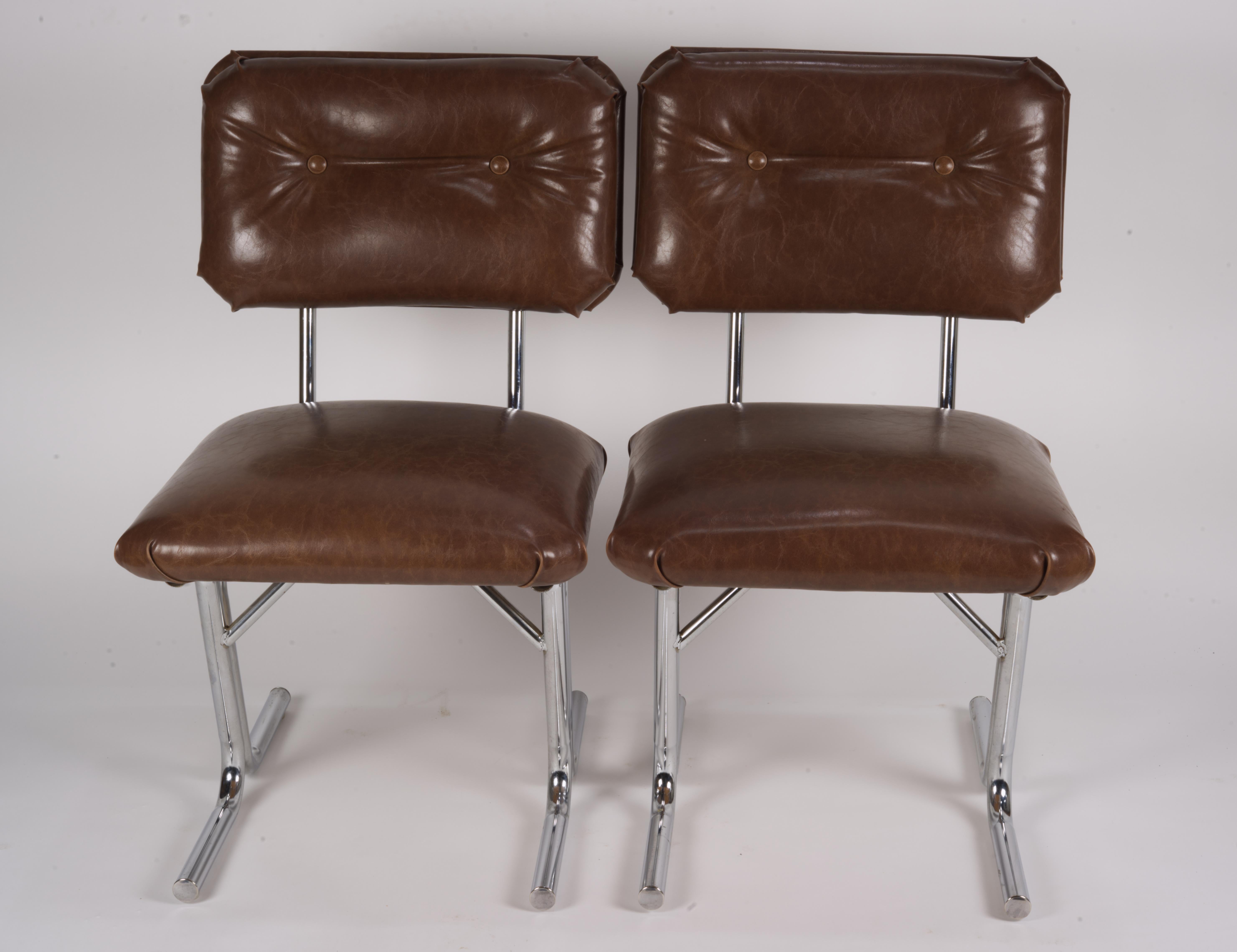 Mid-Century Modern Pair of MCM side chairs in steel and brown vinyl.  For Sale