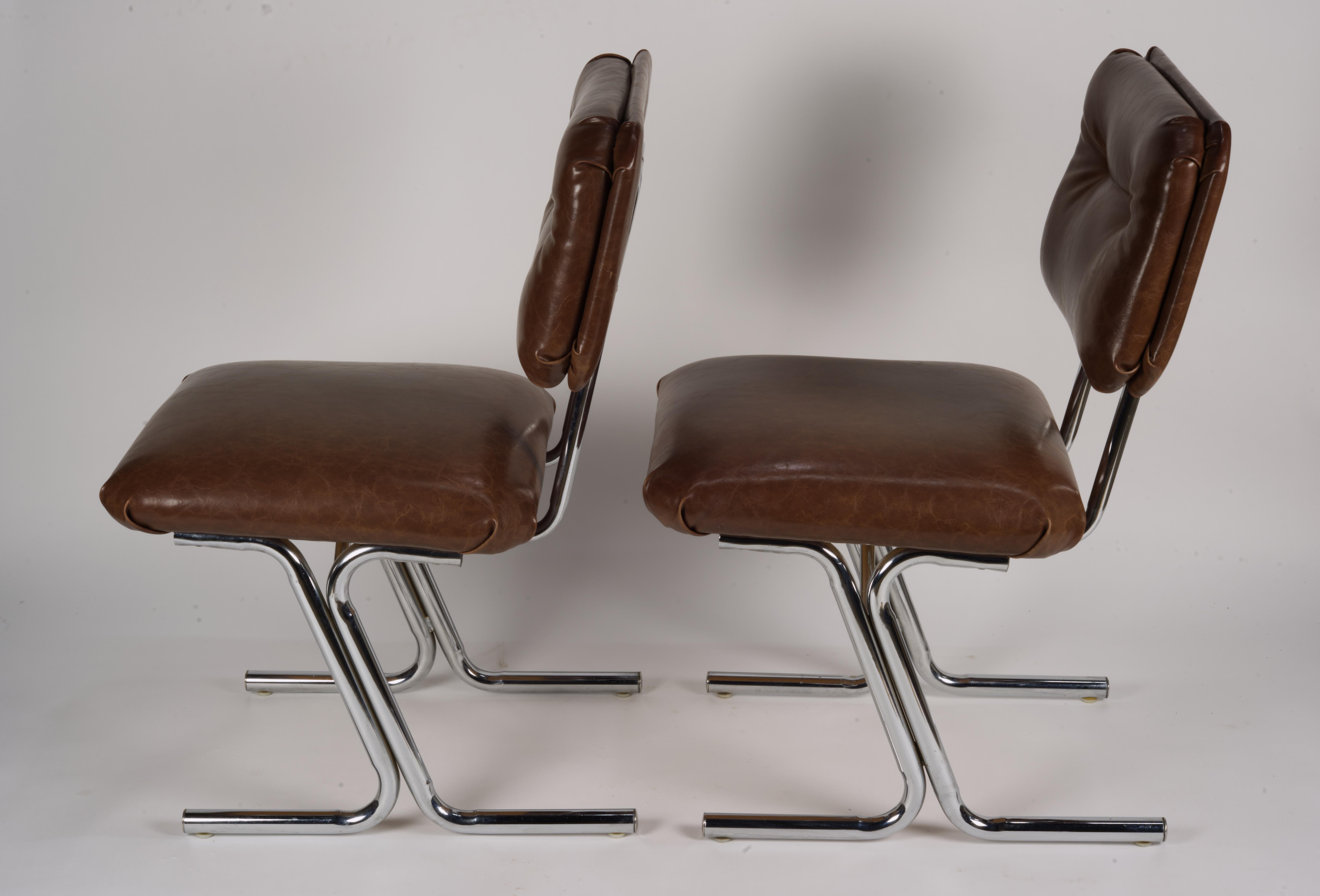 American Pair of MCM side chairs in steel and brown vinyl.  For Sale
