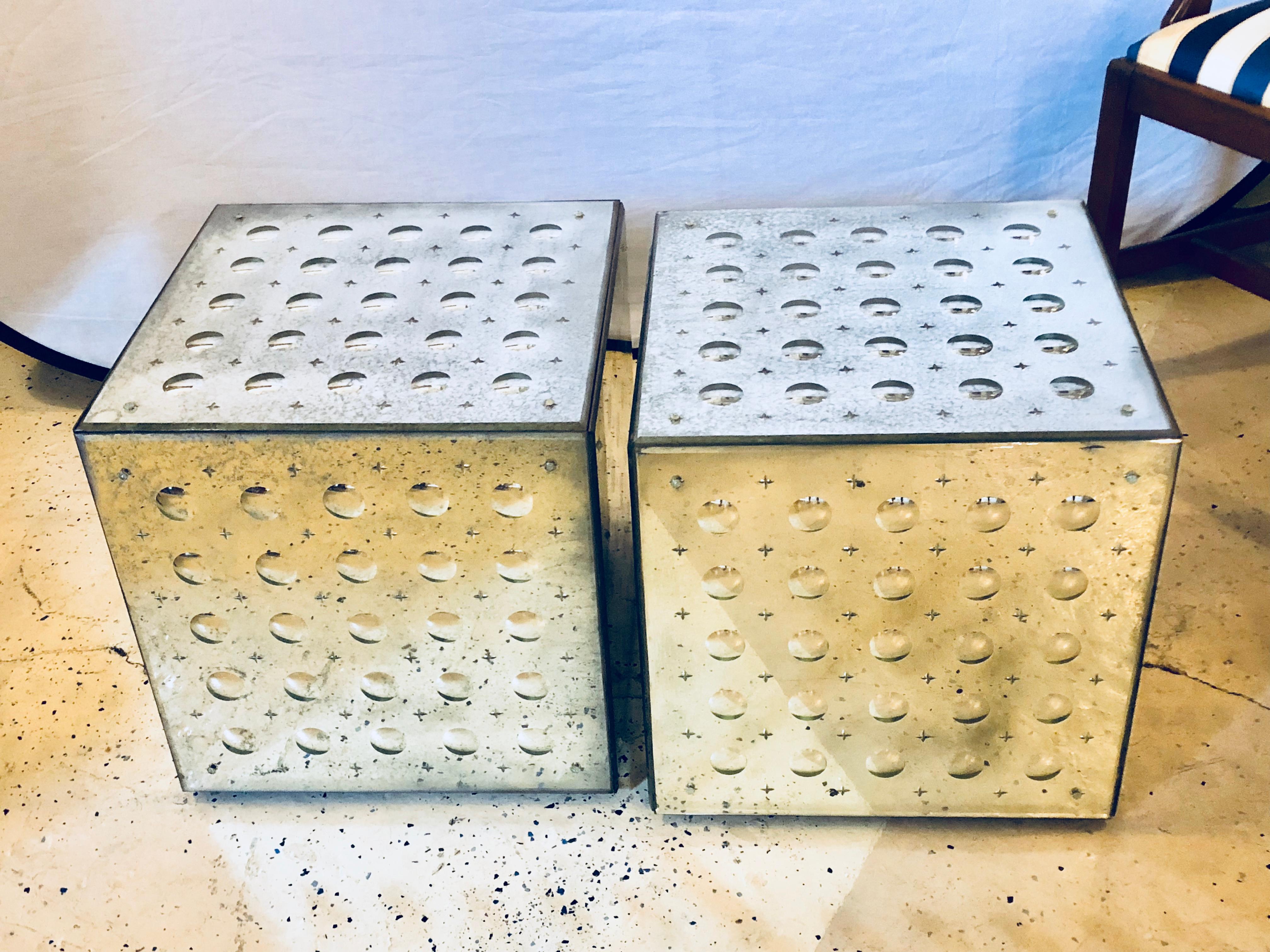 Pair of silver mirrored glass cubes on casters. Midcentury mirrored three-dimensional glass cube coffee or end tables on casters. These appear to be gold however, the color is more silver mirror like. Can be formed to make a rectangular or square