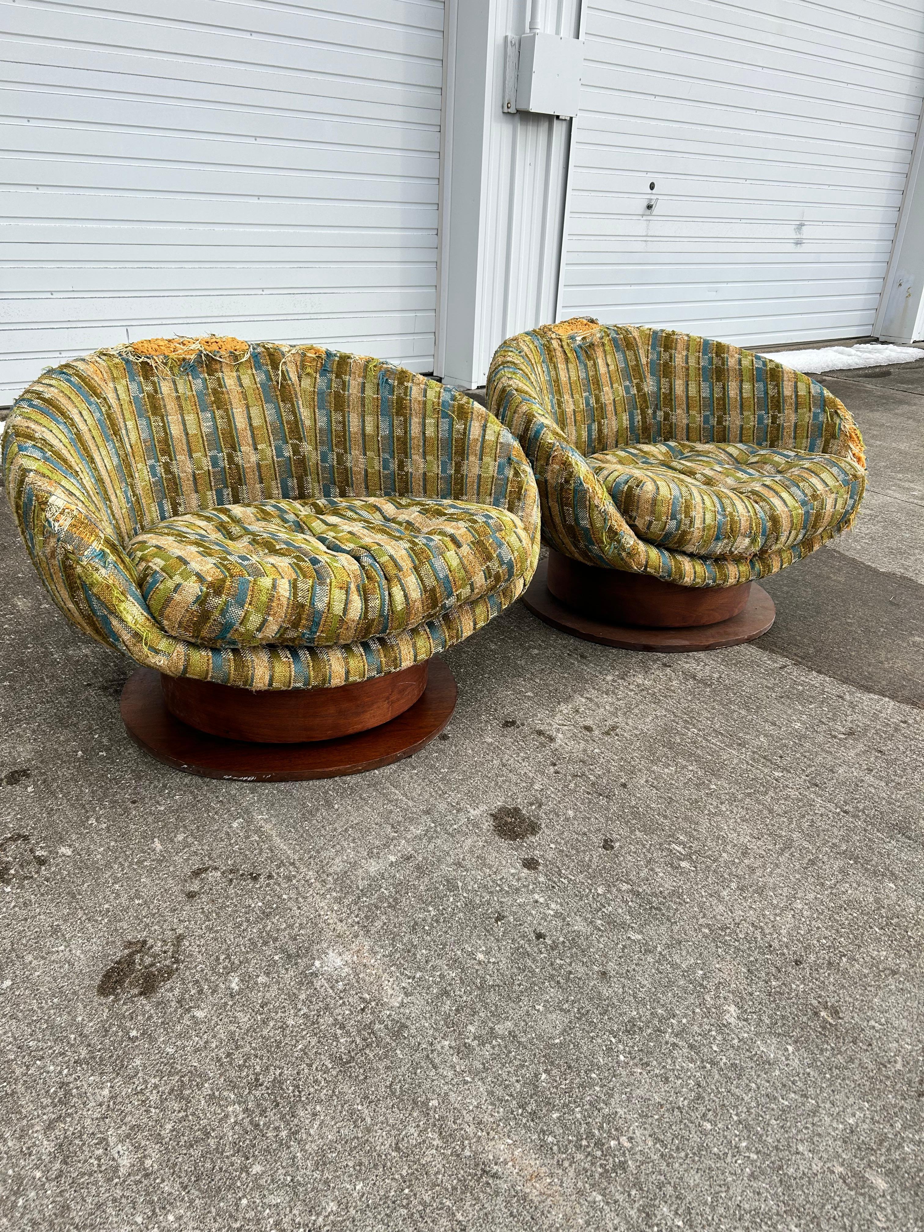 Pair of mid-century swivel egg chairs by Wieland. Because of its age, we recommend that they would be reupholstered and refinished. These chairs have great potential for your mid-century needs! 