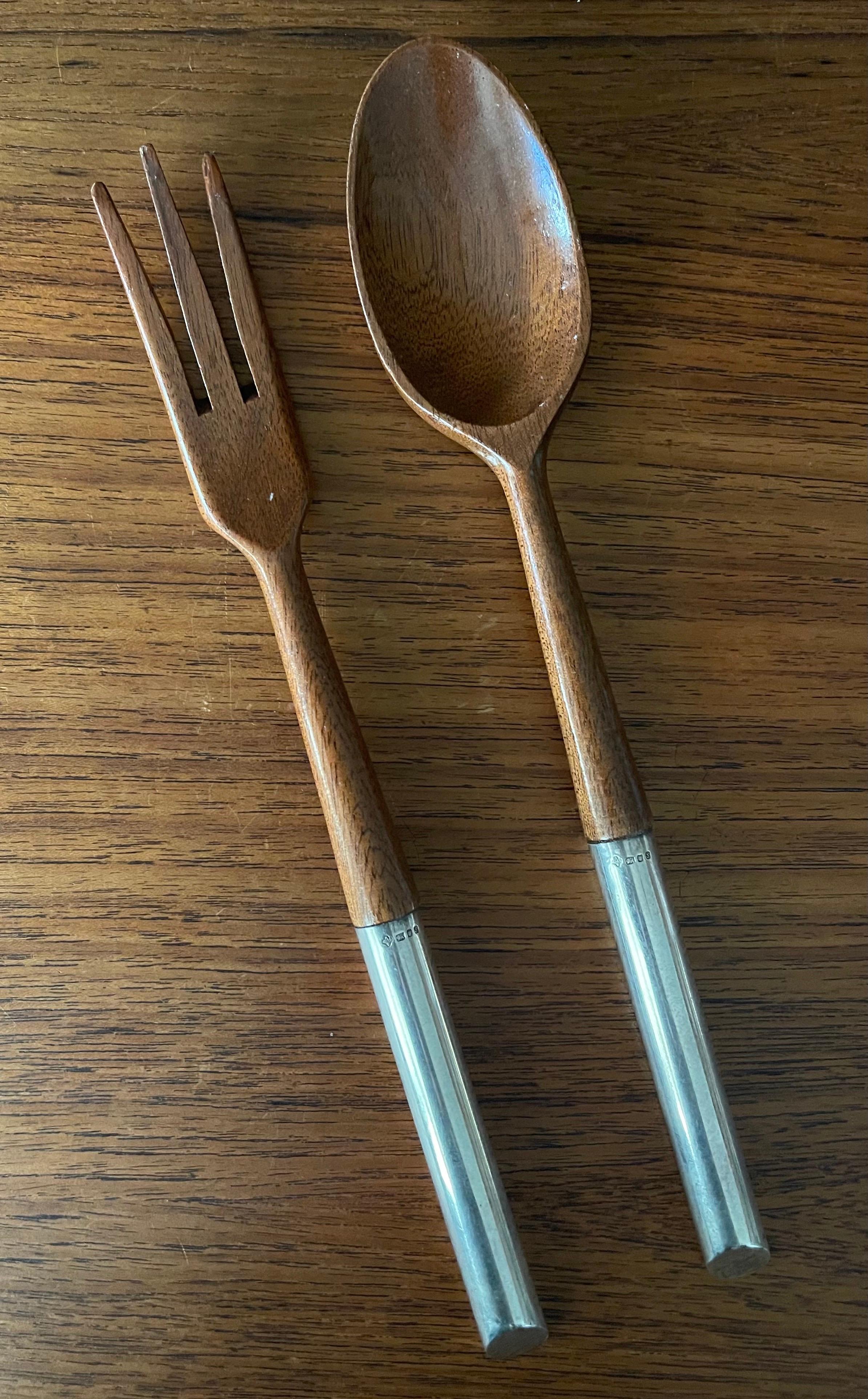Pair of MCM walnut and sterling silver salad servers made in Italy, circa 1970s. The set is in very good vintage condition and would work great with a number of different kinds of salad bowls. The servers measure 11.5