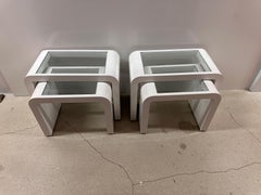 Pair of MCM white and glass top nesting table