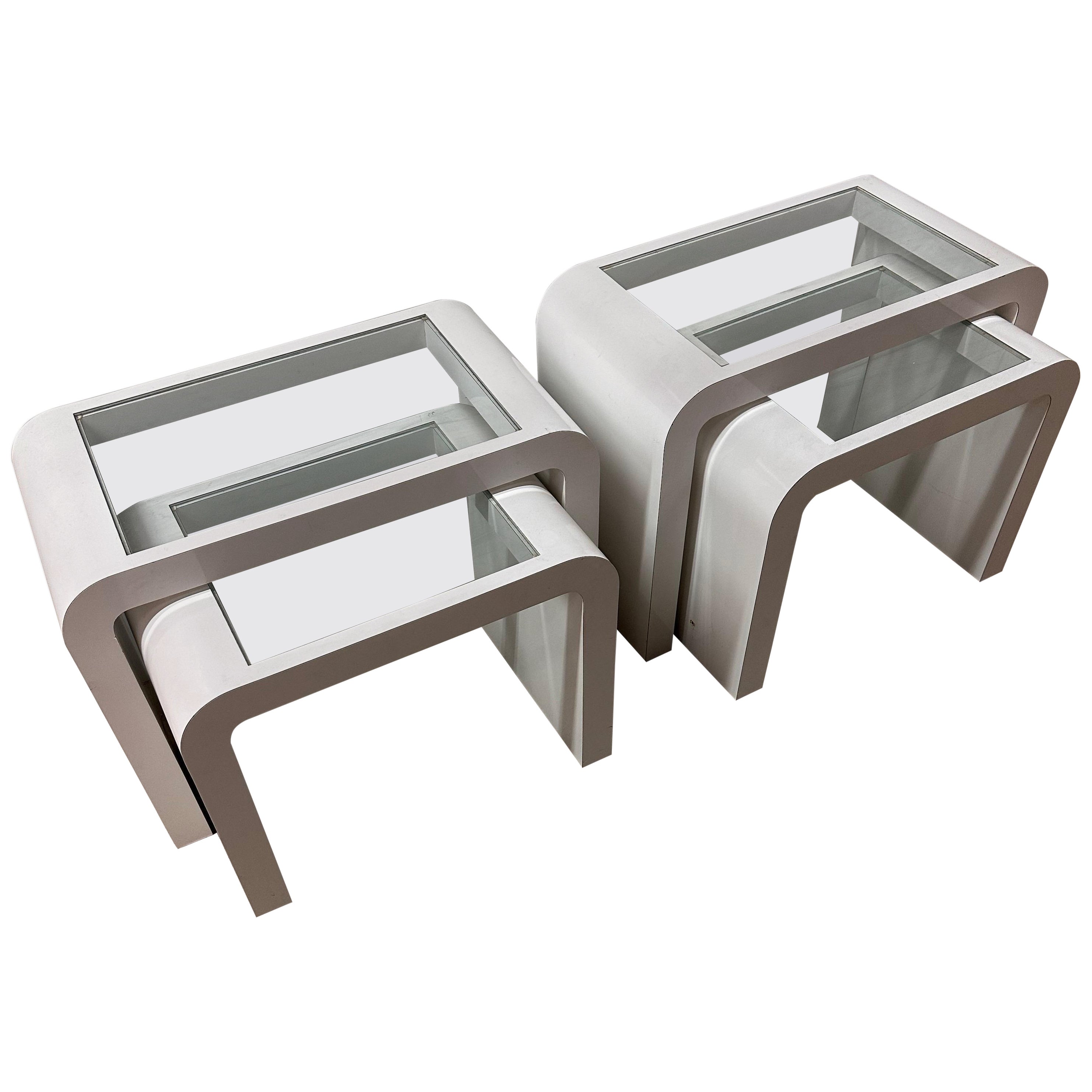 Pair of MCM white and glass top nesting table