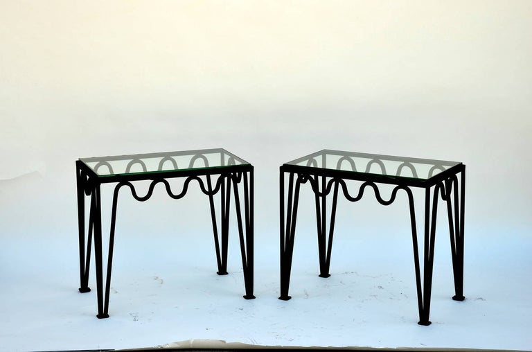 Pair of 'Méandre' blackened steel and glass side tables by Design Frères, in the style of Carl Ho¨rvik.