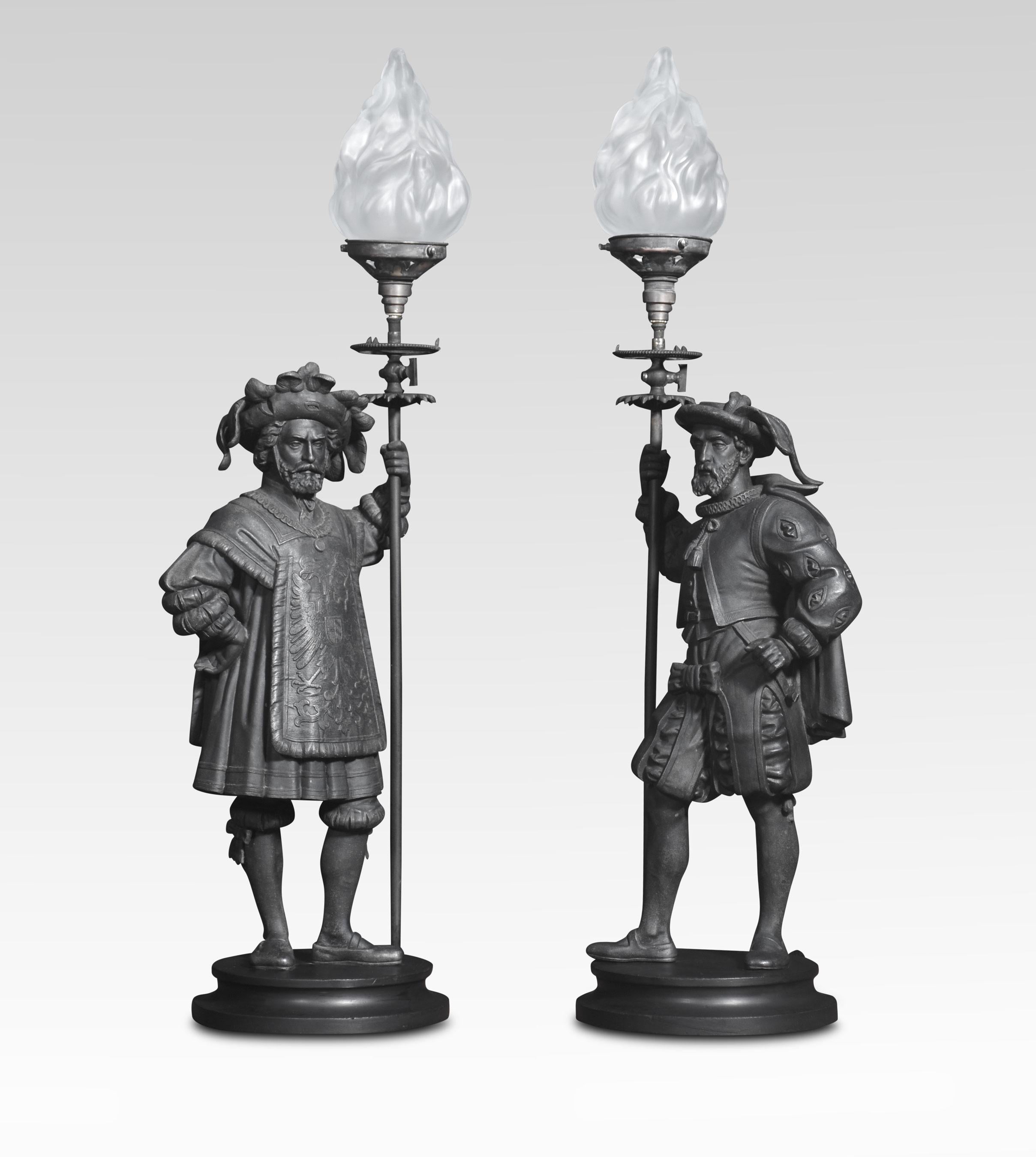 Pair of Spelter table lamps, in the form of medieval figures. Both clenching a flaming torch. Raised up on circular bases. The lamps have been converted to electricity and rewired and tested.
Dimensions
Height 32.5 Inches
Width 11.5 Inches
Depth 8.5