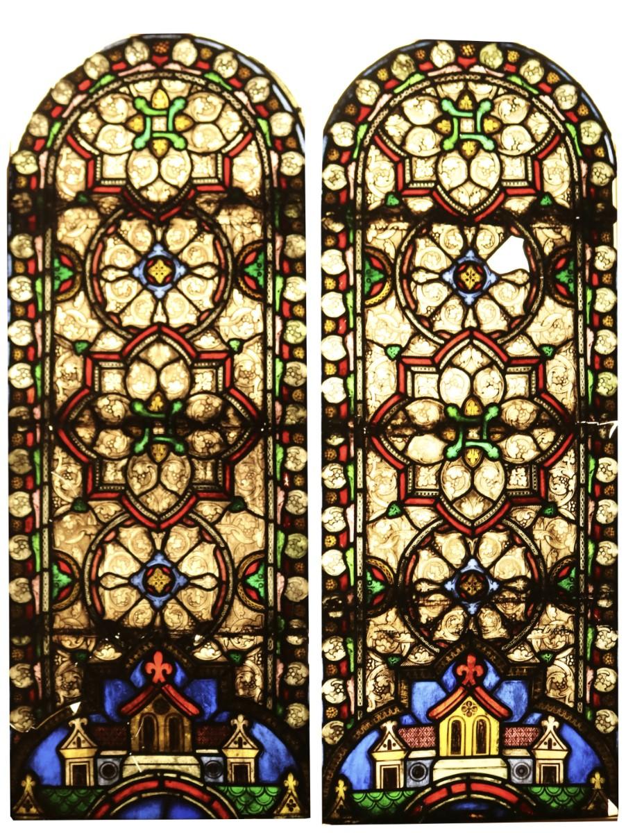 Two large antique stained glass church windows.
 
Each temporary frame 158 x 64.5 x 1 cm