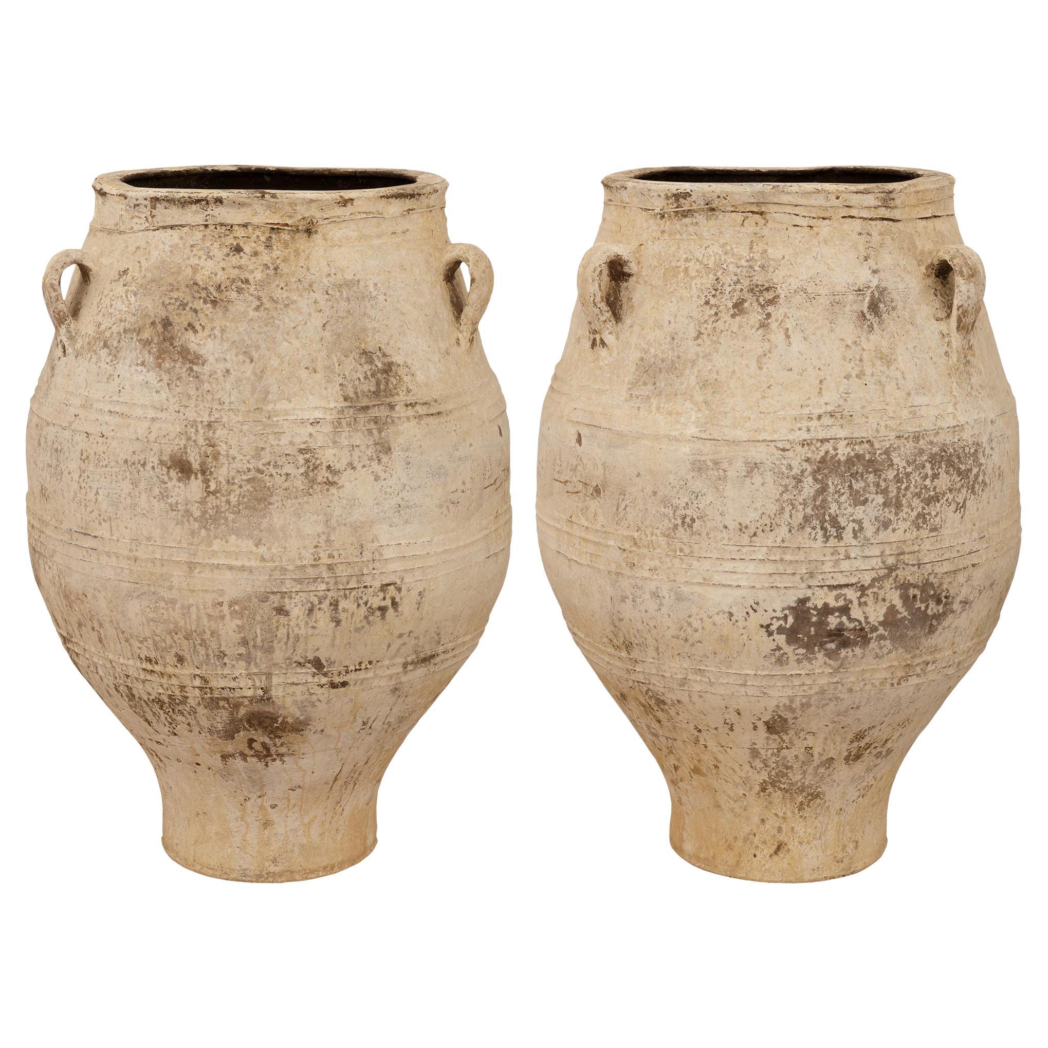 pair of Mediterranean 19th century patinated Terra Cotta olive jars