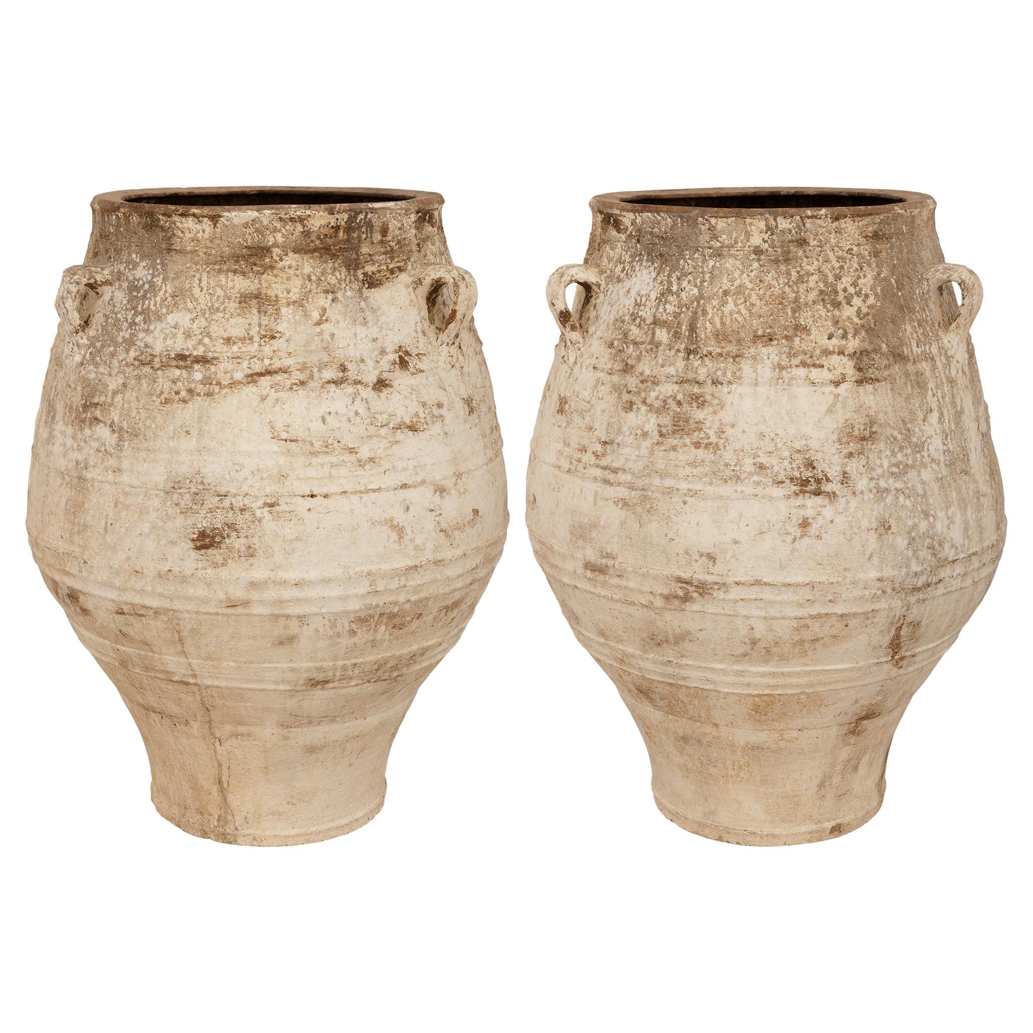 pair of Mediterranean 19th century patinated Terra Cotta olive jars
