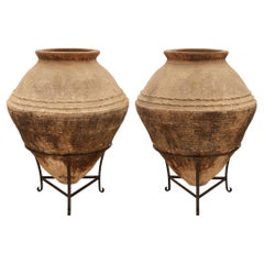 pair of Mediterranean 19th century patinated Terra Cotta olive jars