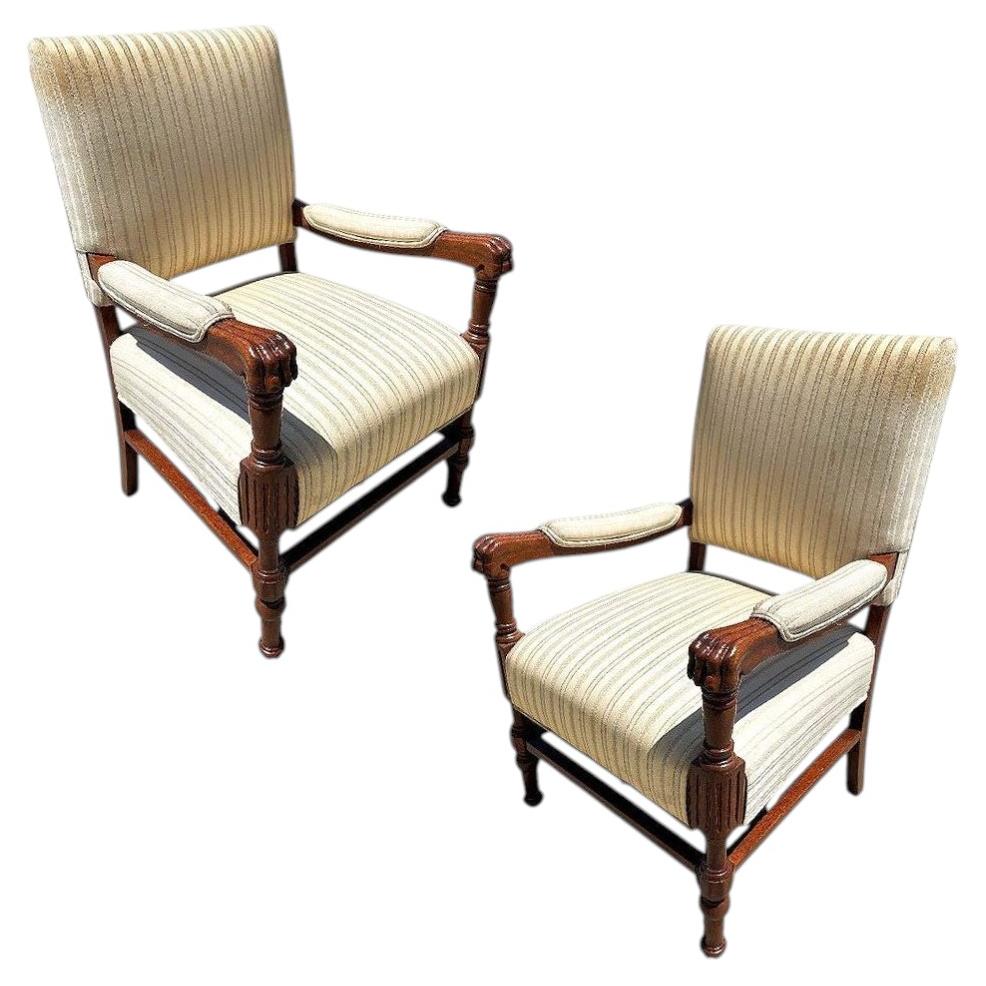 Pair of Mediterranean Style Carved Walnut Lion Paw Armchairs