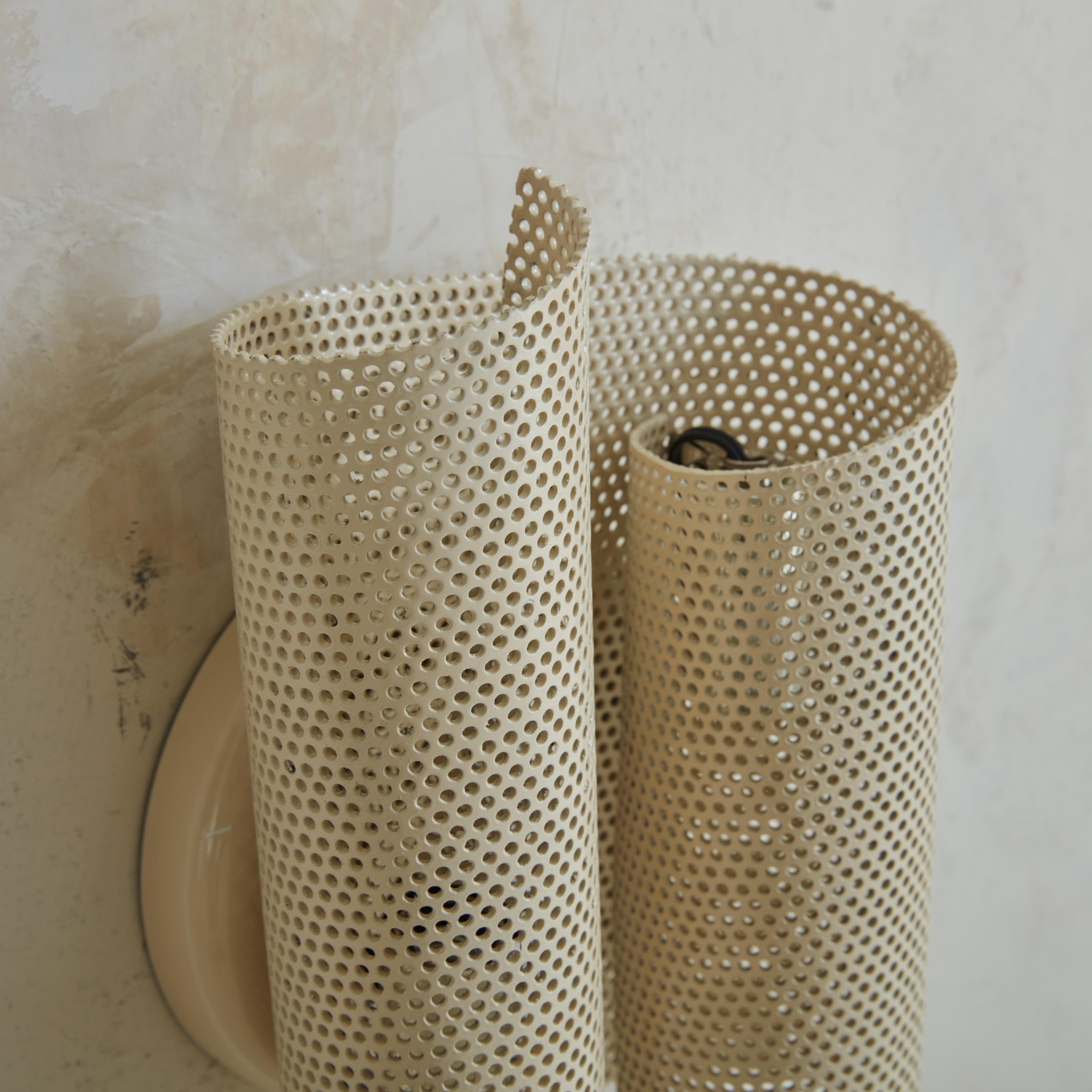 Mid-Century Modern Pair of Medium Perforated Metal Sconces in the Style of Mathieu Matégot For Sale
