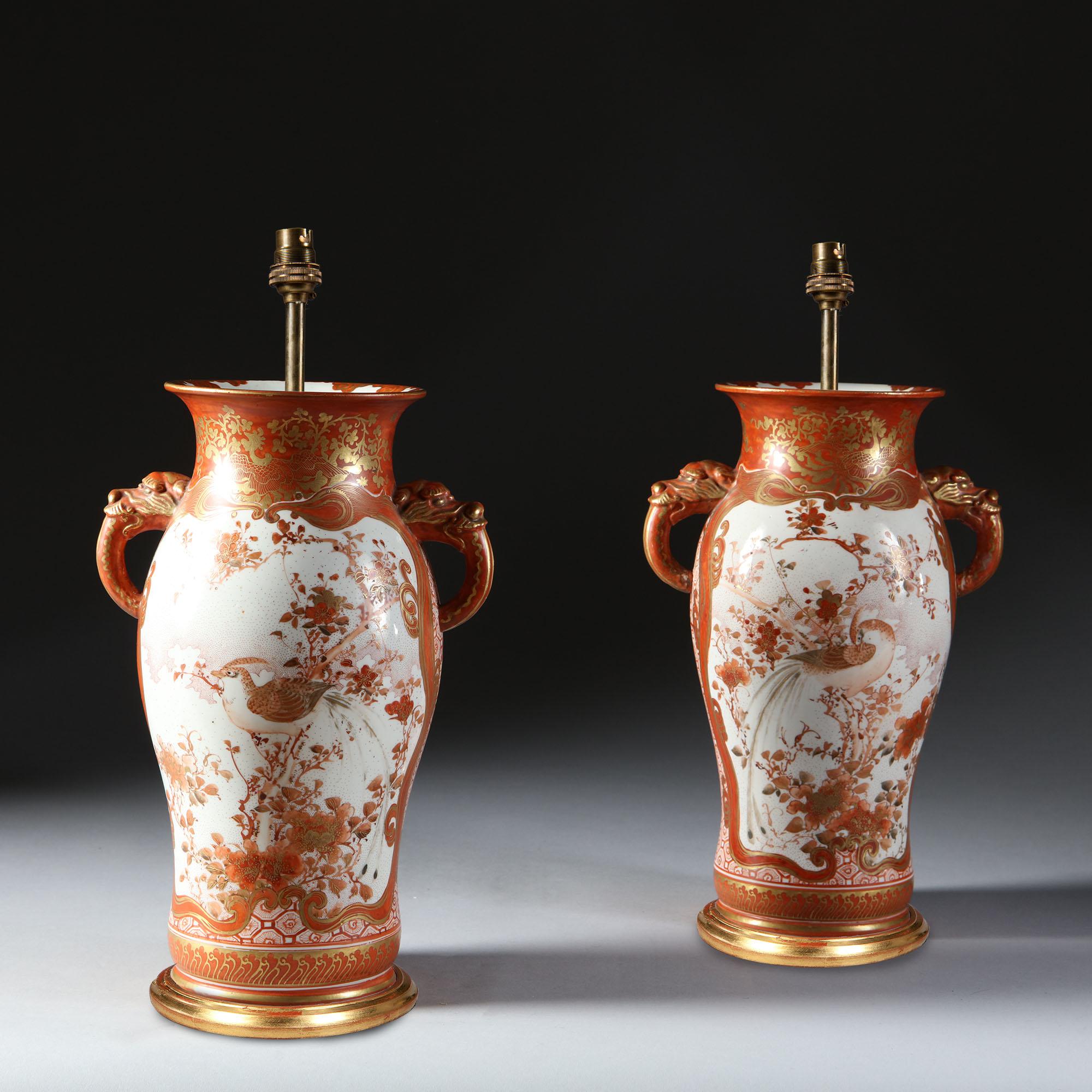 A fine pair of late 19th century Japanese Satsuma porcelain vases. Decorated with fabulously dressed Samurai warriors and monkey gods on a white ground, the surrounding in coral orange with gold highlights.

Now wired for (USA / UK / Rest of