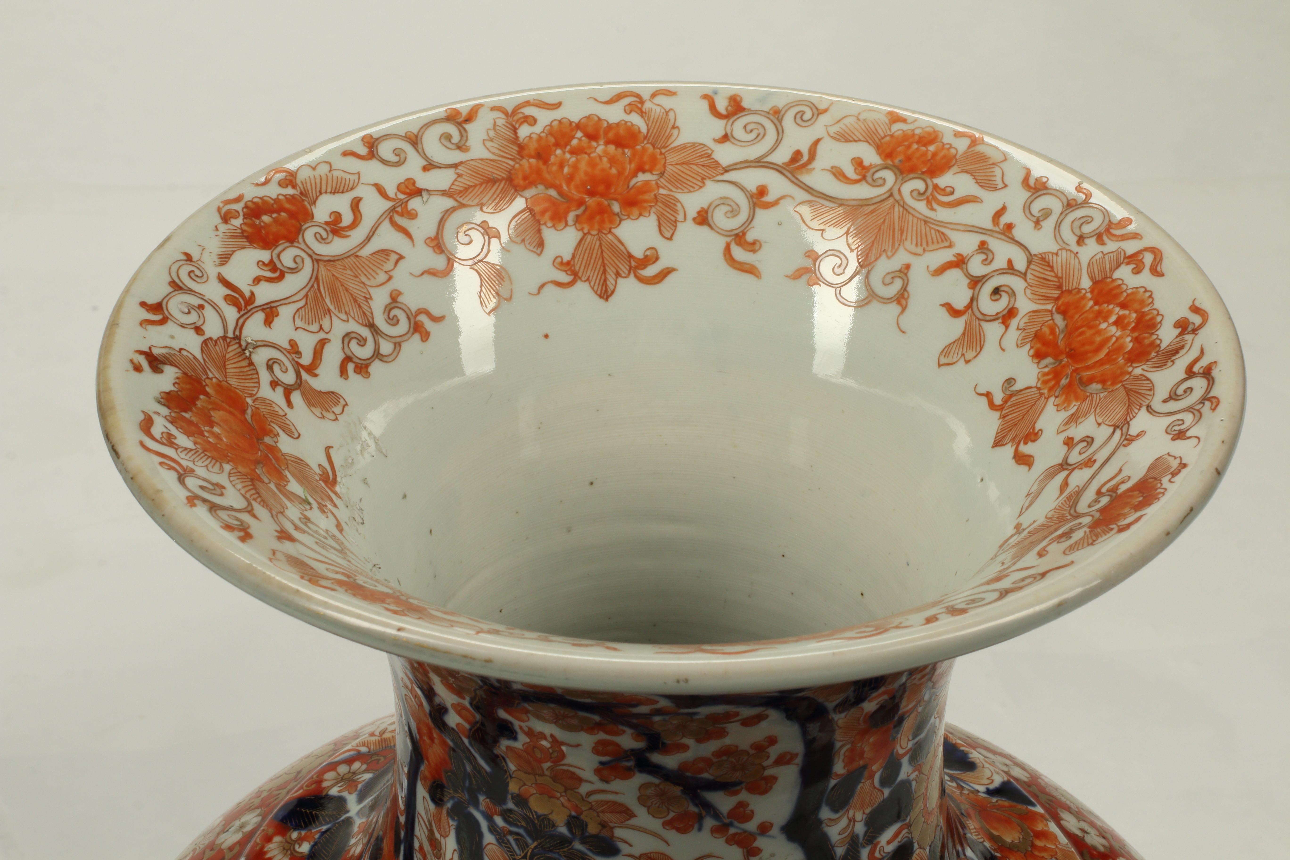 This exquisite pair of Meiji Period Japanese Imari vases stand out for their vibrant and intricate designs. The vases' elegant baluster shape and balanced proportion accentuate the intricate hand painted designs which appear in a traditional mix of