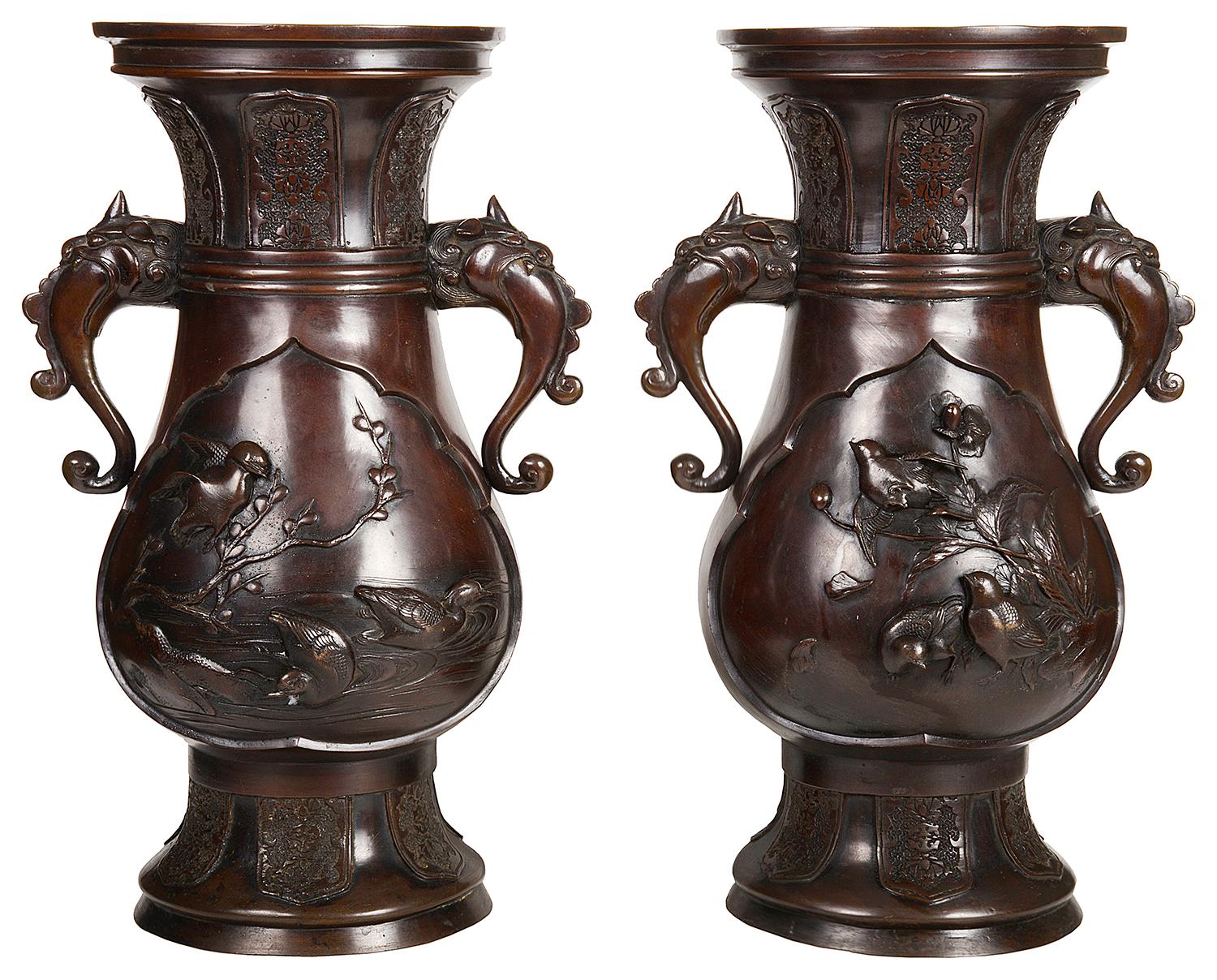 An impressive pair of late 19th century (Meiji period 1868-1912) Japanese bronze vases / lamps. Each with
re-leaf decoration of birds and trees, mythical creatures as handles either side and classical motif decoration to the necks and bases.
These