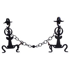 Pair of Meisner Forged Iron Andirons with Footrest Chain