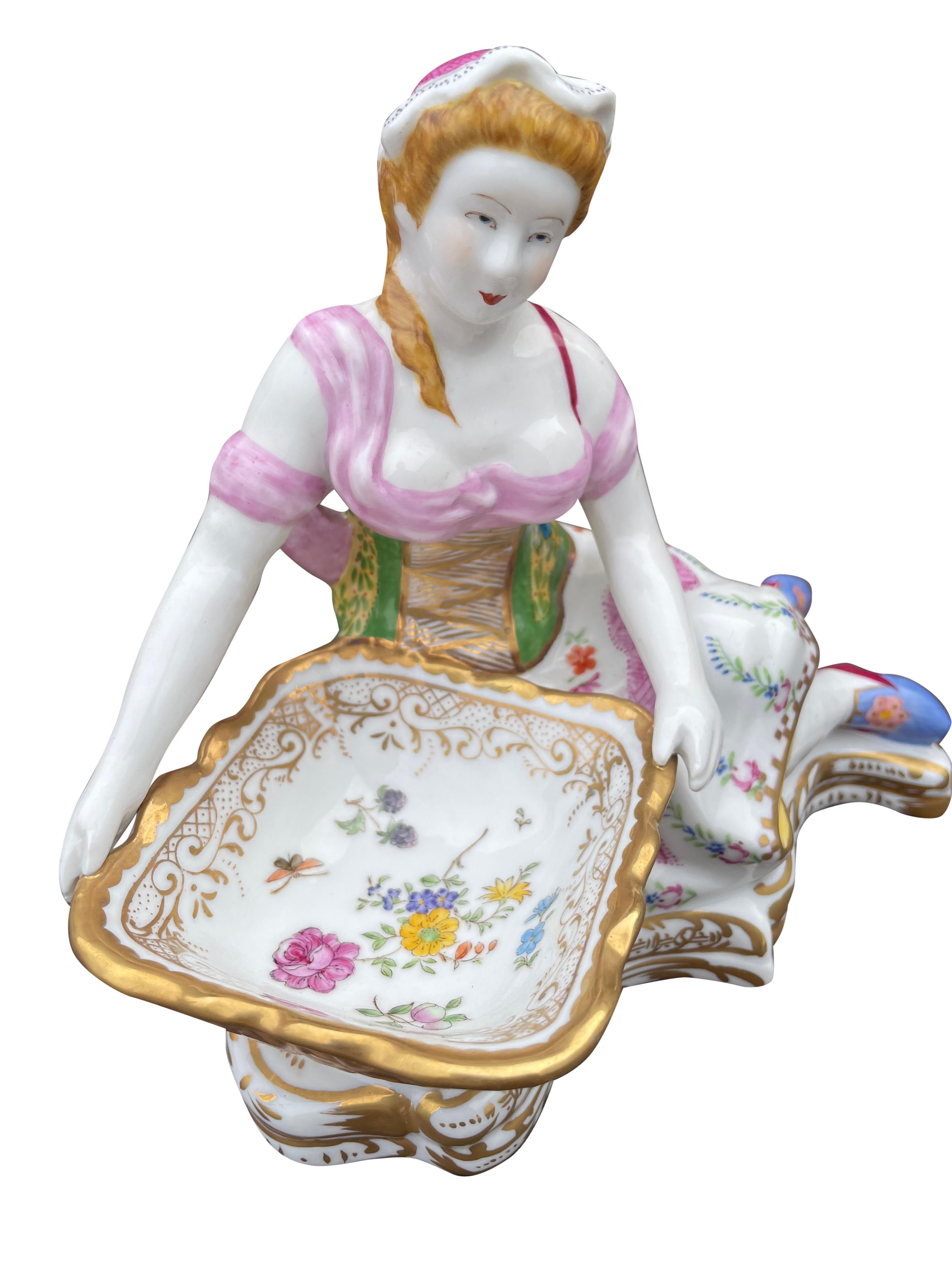 A superb pair of Meissen figurine sweet dishes, 20th century. Scenes of man and woman beautifully hand painted.