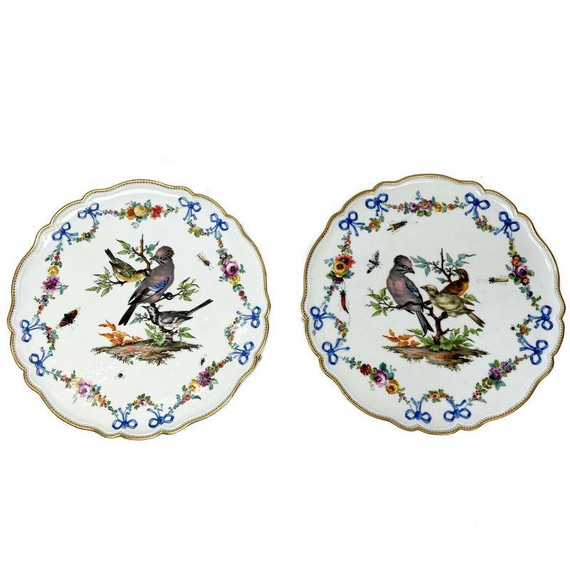Pair meissen marcoloni ornithological porcelain footed trays or cake plates.

Pair meissen German marcoloni period hand painted ornithological decoration porcelain footed trays or cake plates, circa 1800. Scalloped rimmed trays with hand painted