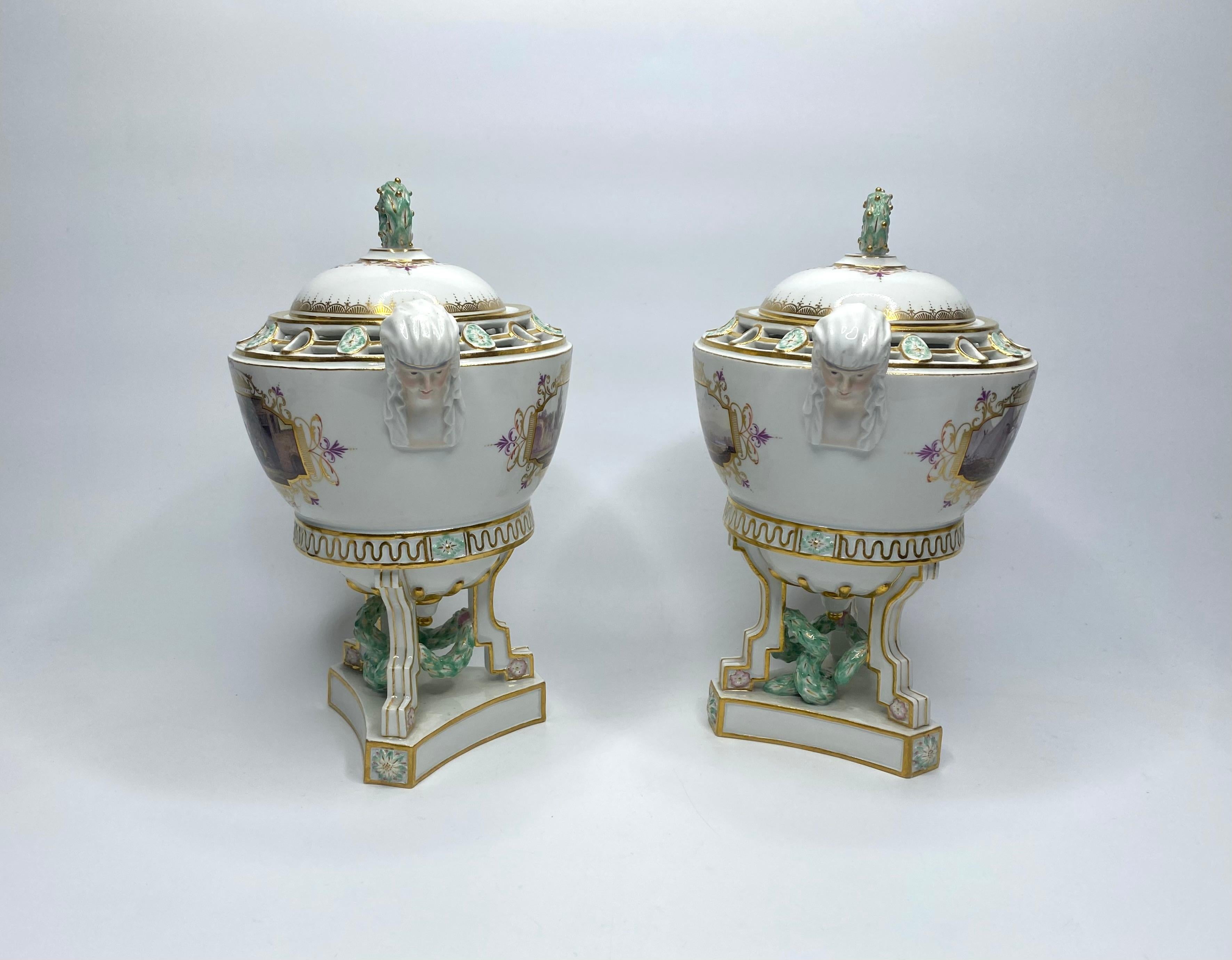 A fine pair of Meissen porcelain pot pourri and cover, c. 1870. Modelled in Marcolini Period style, each pot pourri having pierced shoulders, supported upon three angular feet, with suspended garlands, and set on canted bases, moulded with rosettes.