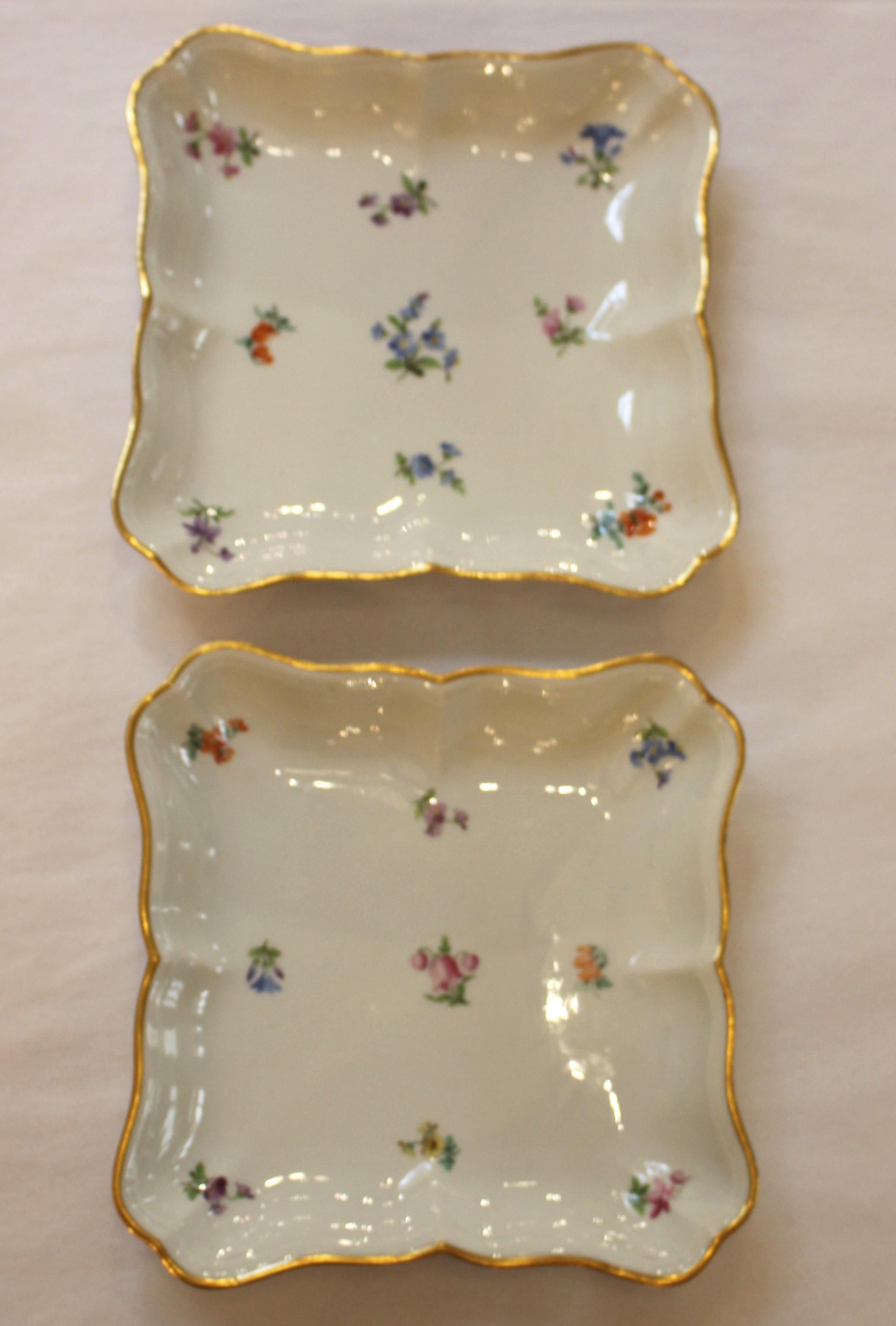 Pair of square serving dishes or sweetmeats with gilt shaped edges (minor wear), by Meissen in the scattered flowers or streublumen pattern. Crossed swords mark. c.1860-90. 8 1/4