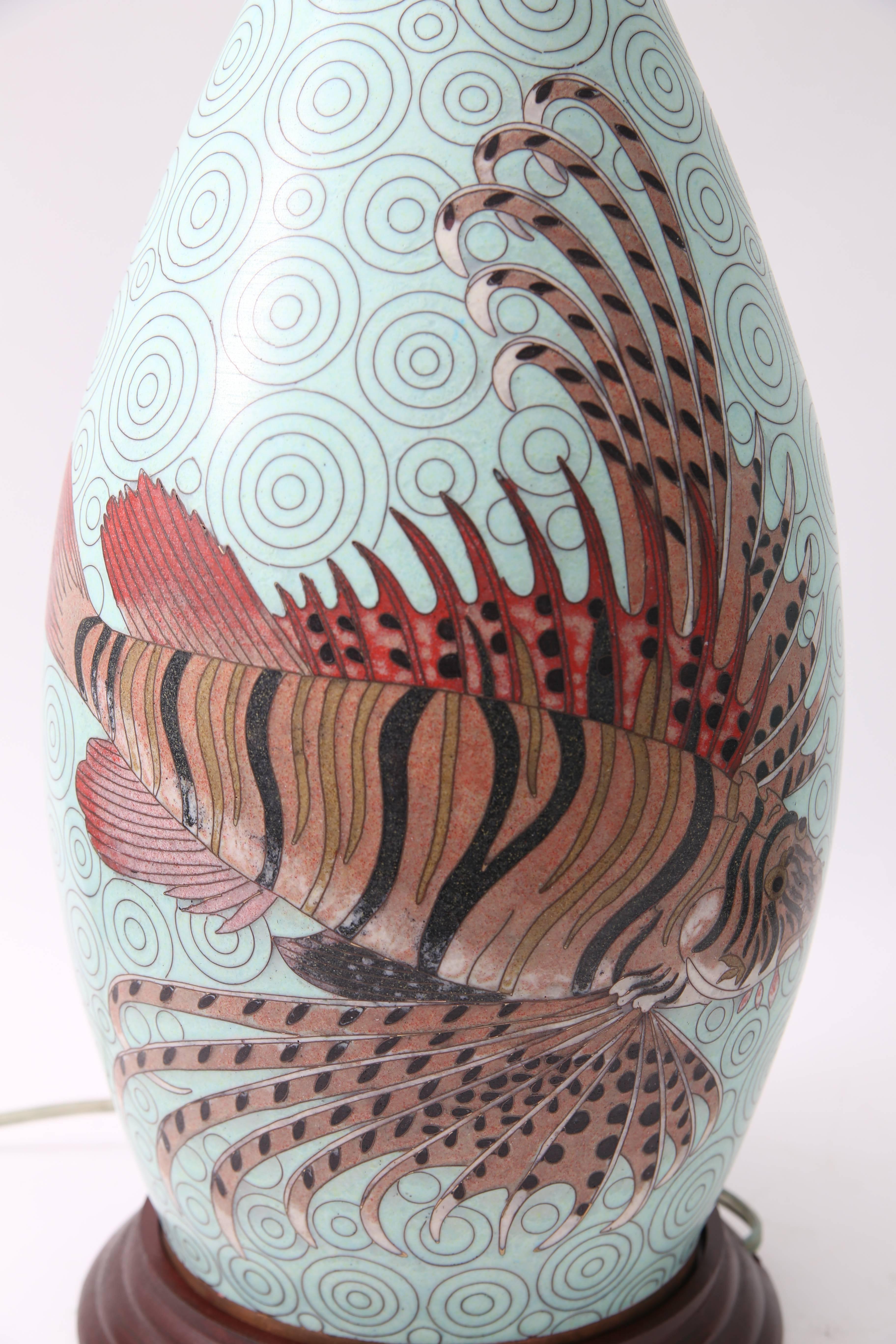 This stylish pair of Meji, Japanese style cloisonné table lamps were created by Fabienne Jouvin (Paris) and were recently acquired from a Palm Beach estate. The lion fish is quite striking against the turquoise background.

Note: Dimension to top